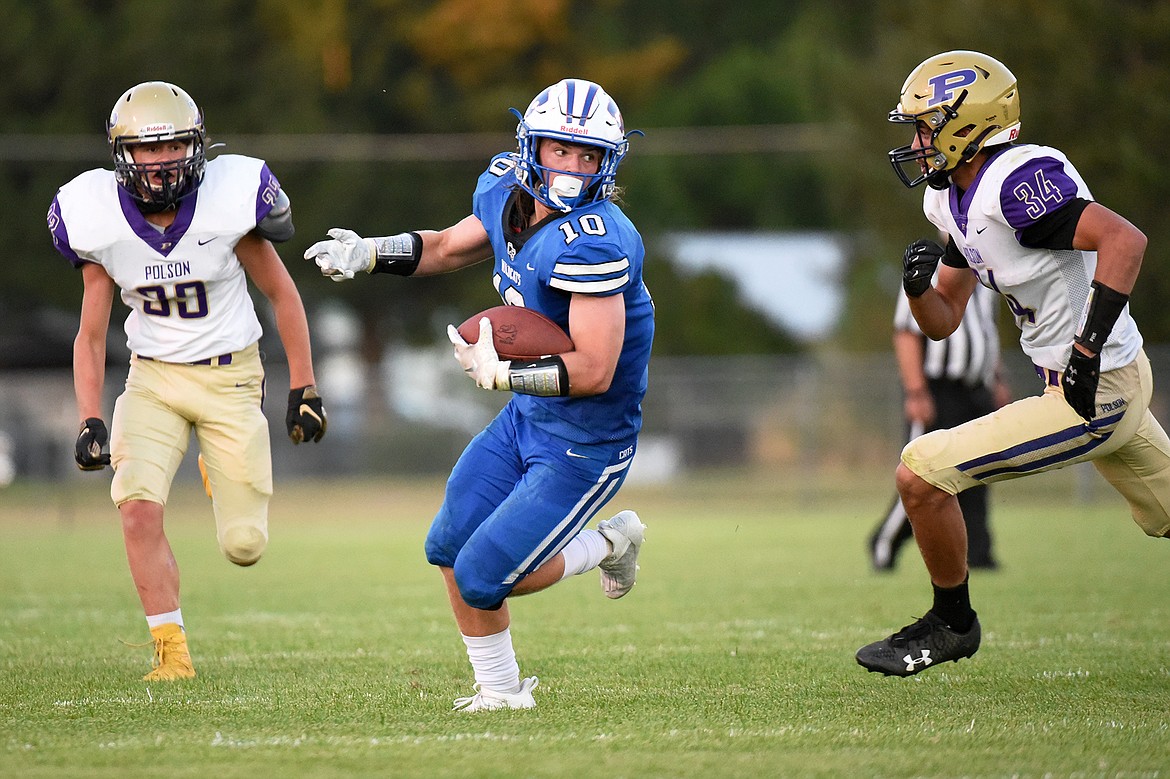 Columbia Falls wide receiver Cade Morgan (10) is brought down by Polson’s Boston Goode (34) after a second-quarter reception at Satterthwaite Memorial Field on Friday. (Casey Kreider/Daily Inter Lake)