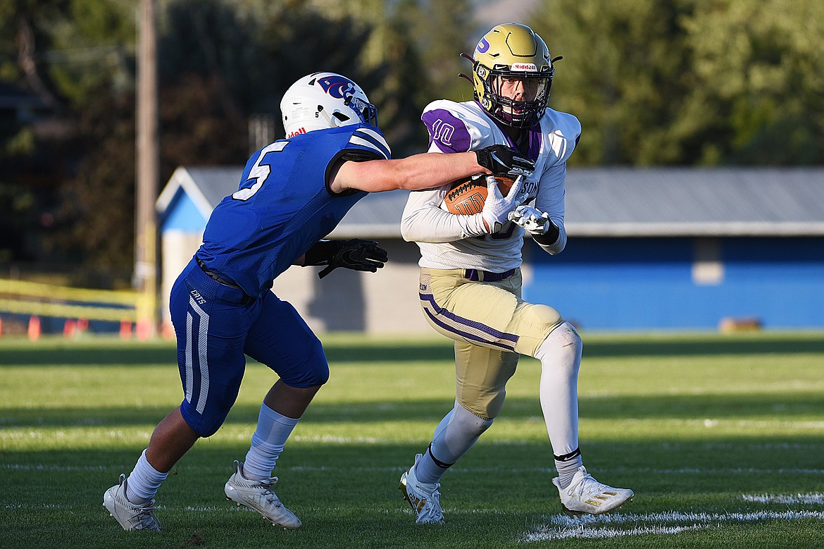 Polson wide receiver Colton Graham (10) is brought down by Columbia Falls safety Isaiah Roth (5) after a reception in the first half at Satterthwaite Memorial Field on Friday. (Casey Kreider/Daily Inter Lake)