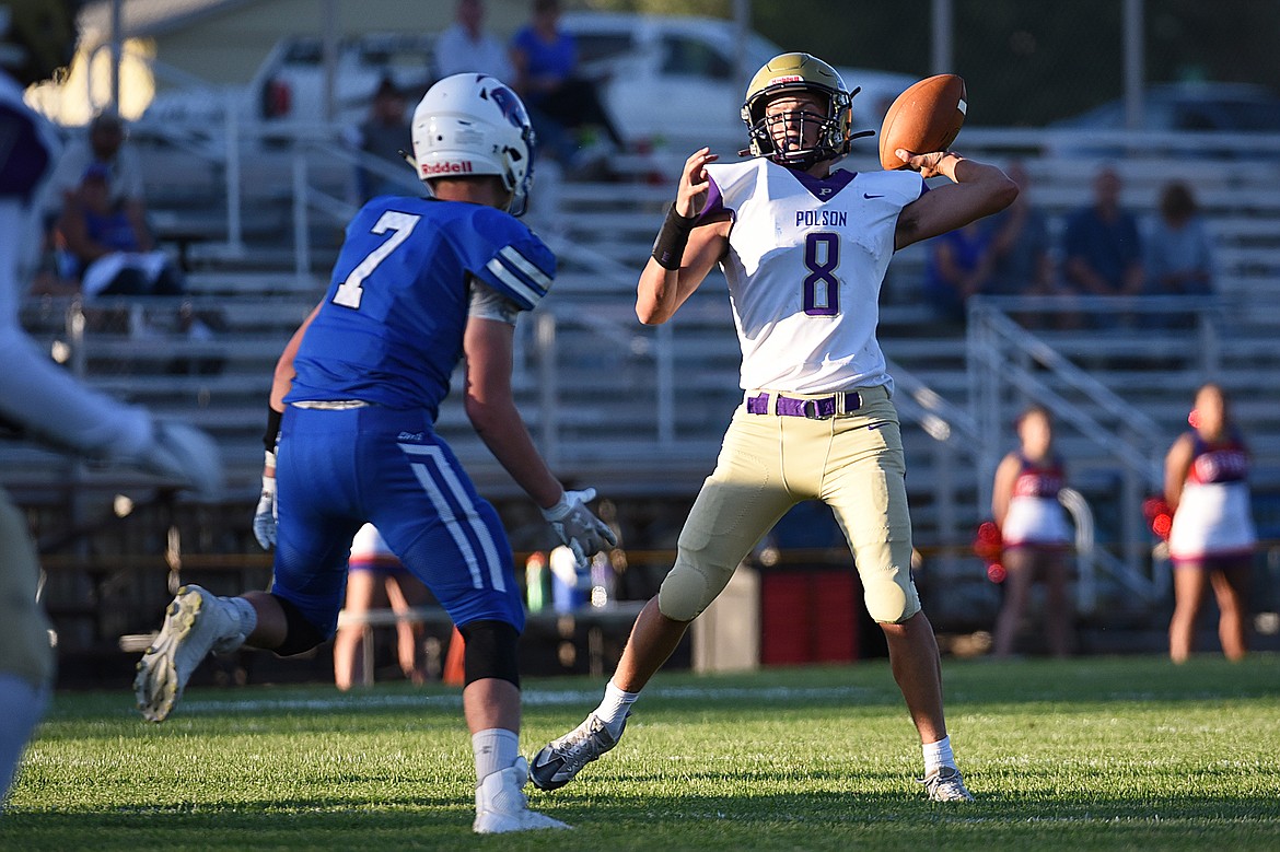 Polson quarterback Jarrett Wilson (8) looks to throw under pressure from Columbia Falls linebacker Reis Rouig (7) at Satterthwaite Memorial Field on Friday. (Casey Kreider/Daily Inter Lake)