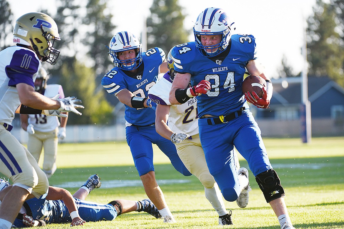 Columbia Falls wide receiver Jordan Knapton (34) runs after making a first-quarter reception against Polson at Satterthwaite Memorial Field on Friday. (Casey Kreider/Daily Inter Lake)