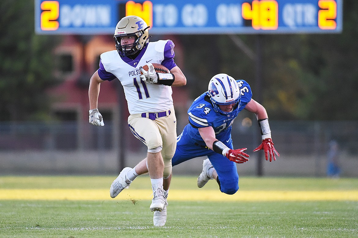 Polson wide receiver Ethan McCauley (11) breaks free on a long touchdown reception in the second quarter against Columbia Falls at Satterthwaite Memorial Field on Friday. (Casey Kreider/Daily Inter Lake)