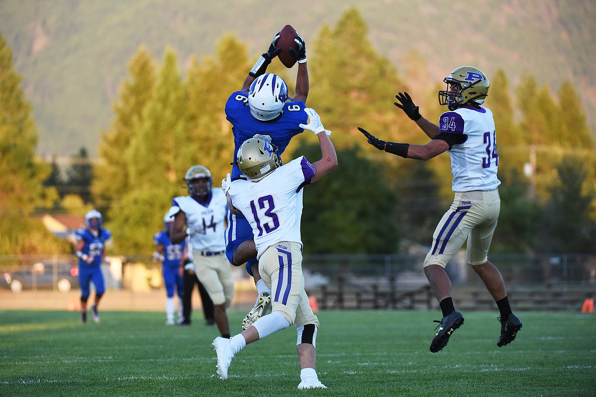 Columbia Falls wide receiver Gabe Sanchez pulls down a long reception in the second quarter against Polson at Satterthwaite Memorial Field on Friday. (Casey Kreider/Daily Inter Lake)