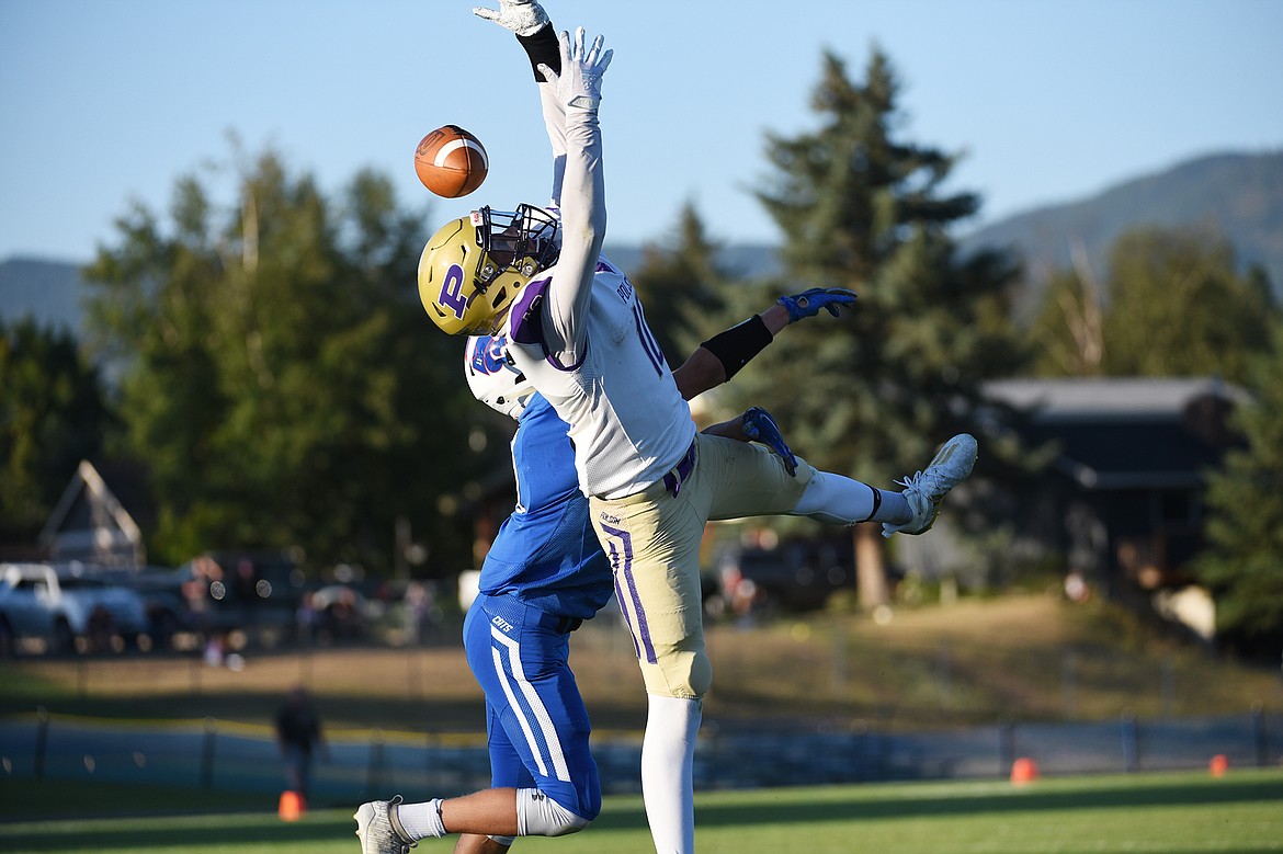 Columbia Falls safety Zane McCallum (11) breaks up a pass intended for Polson wide receiver Colton Graham in the first half at Satterthwaite Memorial Field on Friday. (Casey Kreider/Daily Inter Lake)