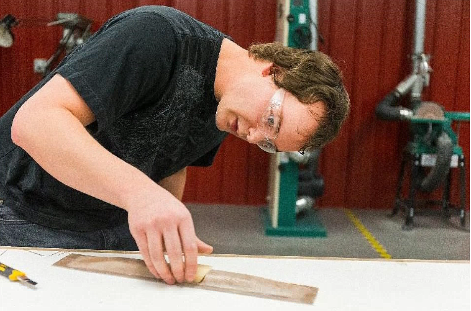 Dylan Mosgrove checks the fit of some parts while working on a tensile bar repair project during a 2016 class at the North Idaho College Aerospace Center. High cost, low student enrollment and the pandemic have contributed to the college's decision to close the center at the end of the school year.