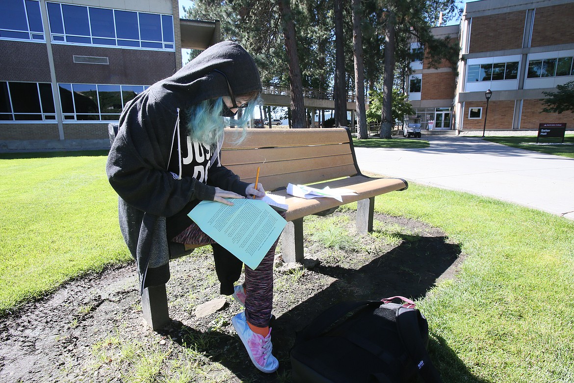 Journalism major Isabel Cruz enjoys a peaceful moment to study outside Lee-Kildow Hall on Friday.