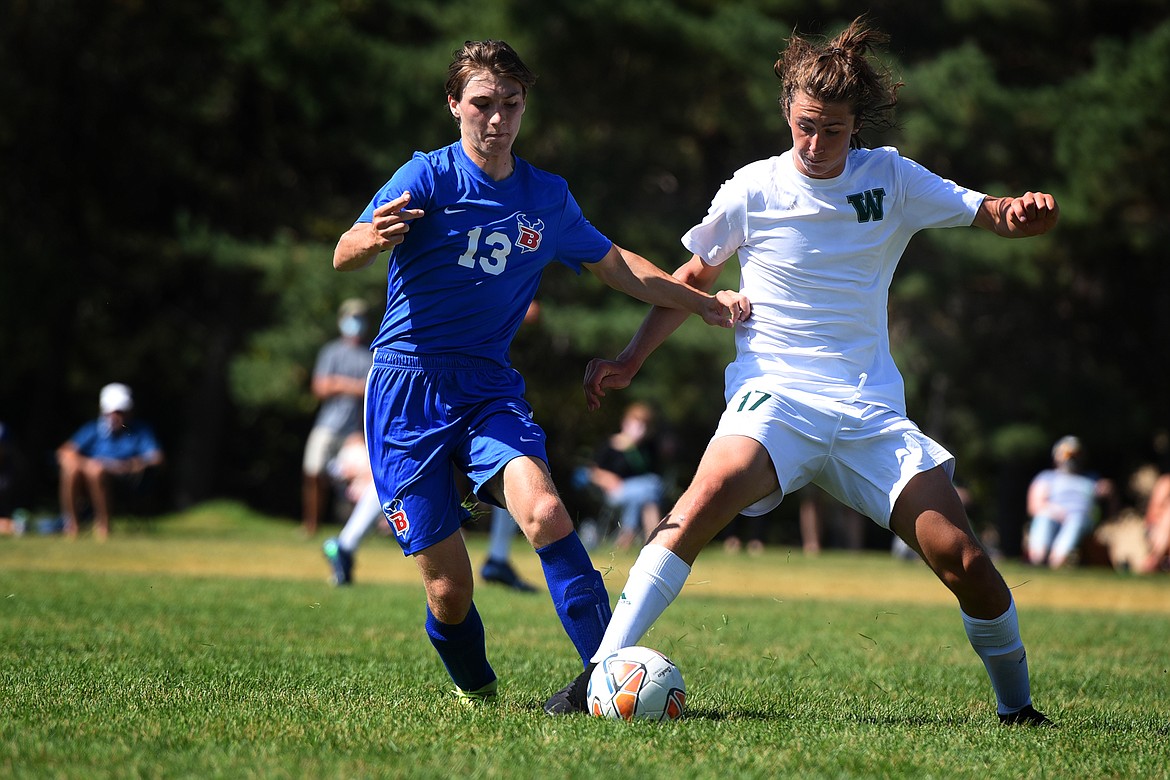 Whitefish midfielder James Thompson takes the ball from Bigfork's Levi Peterson Saturday. (Jeremy Weber/Daily Inter Lake)