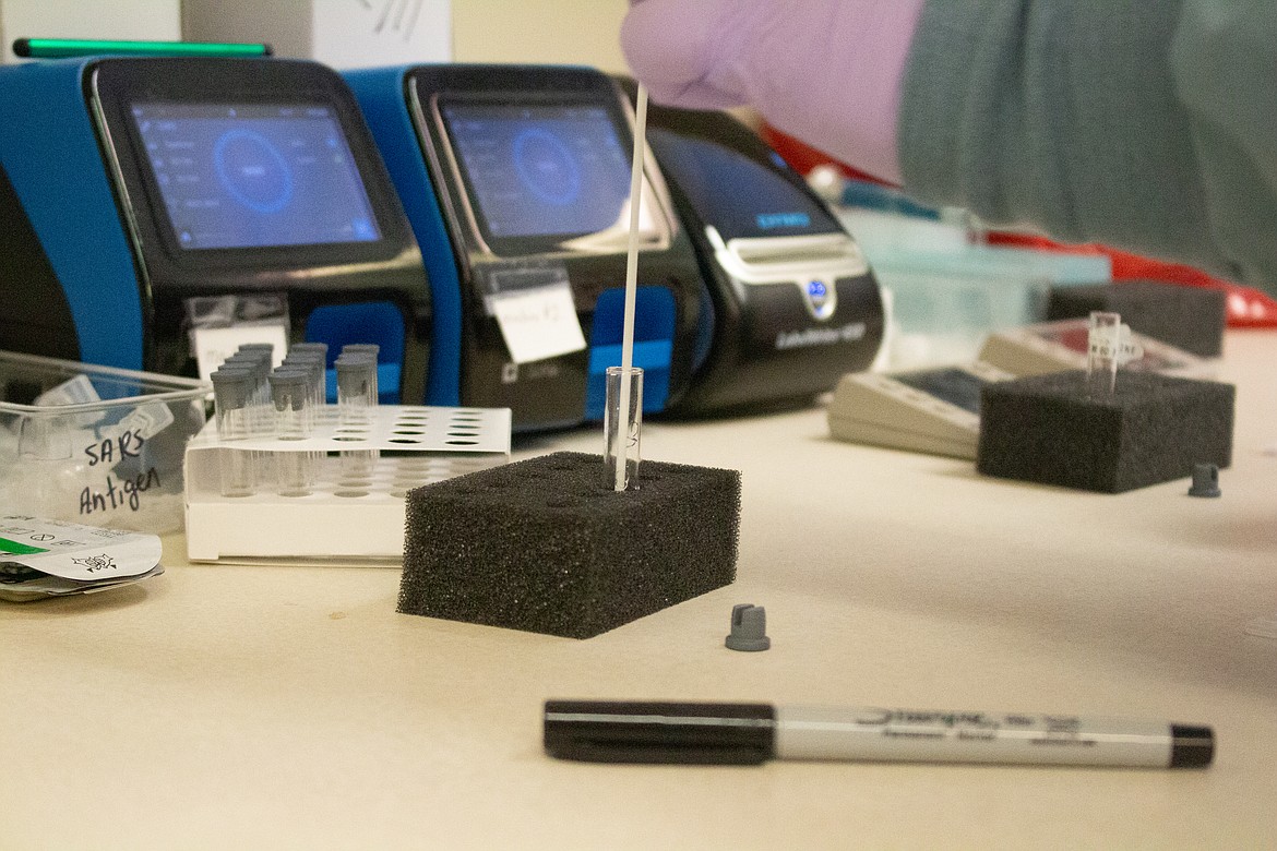Cartridges loaded with samples from the antigen test are loaded into small, toaster-sized diagnostic tools called Sophia, produced by California-based healthcare manufacturer Quidel. After 15 minutes, the screen displays either a negative sign or a positive sign, depending on whether antigens were detected.
