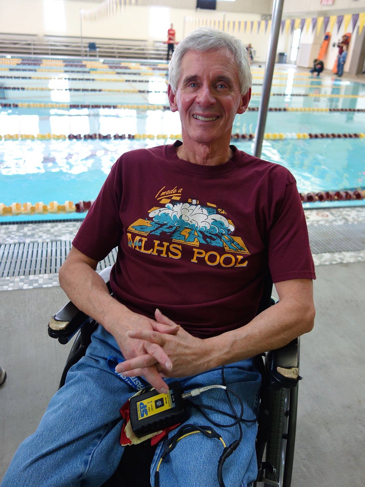 Moses Lake High School swim coach Tony St. Onge hangs out beside the high school pool at a swim team reunion in 2009.