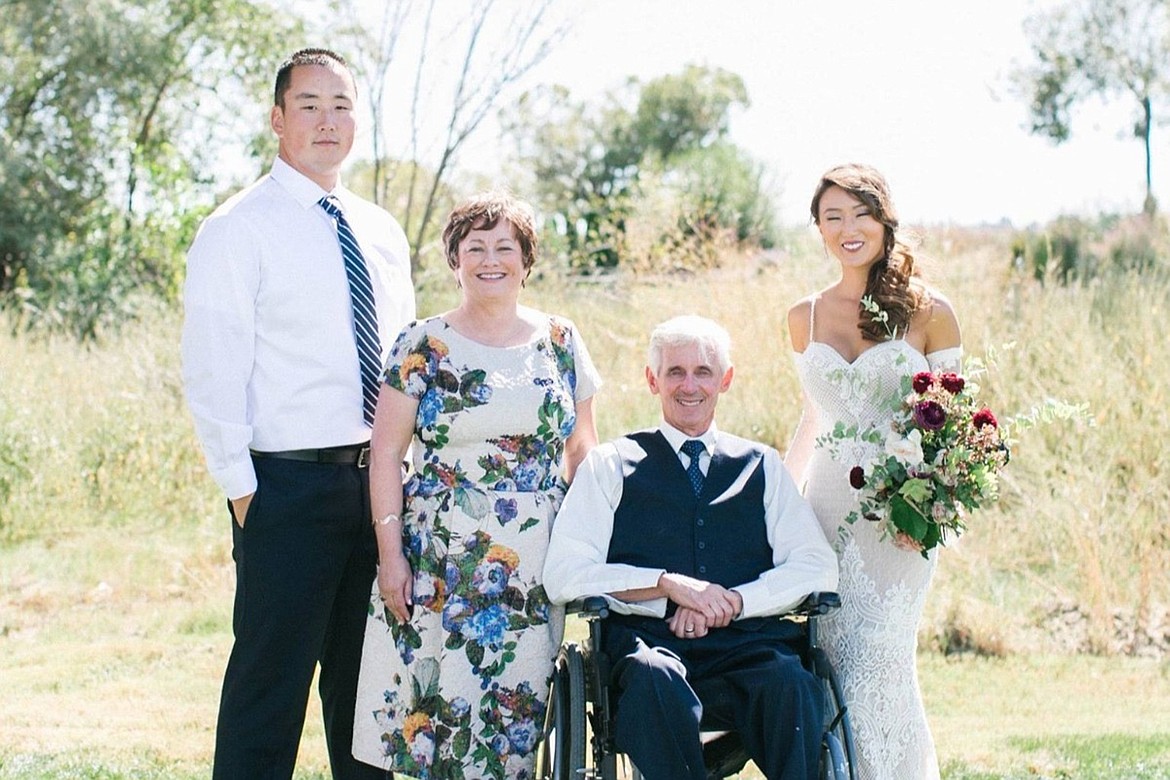 Left to right, Tyler, Jill, Tony, and Joanne St. Onge smile together as the family gathered together for Joanne's wedding day in September, 2016.