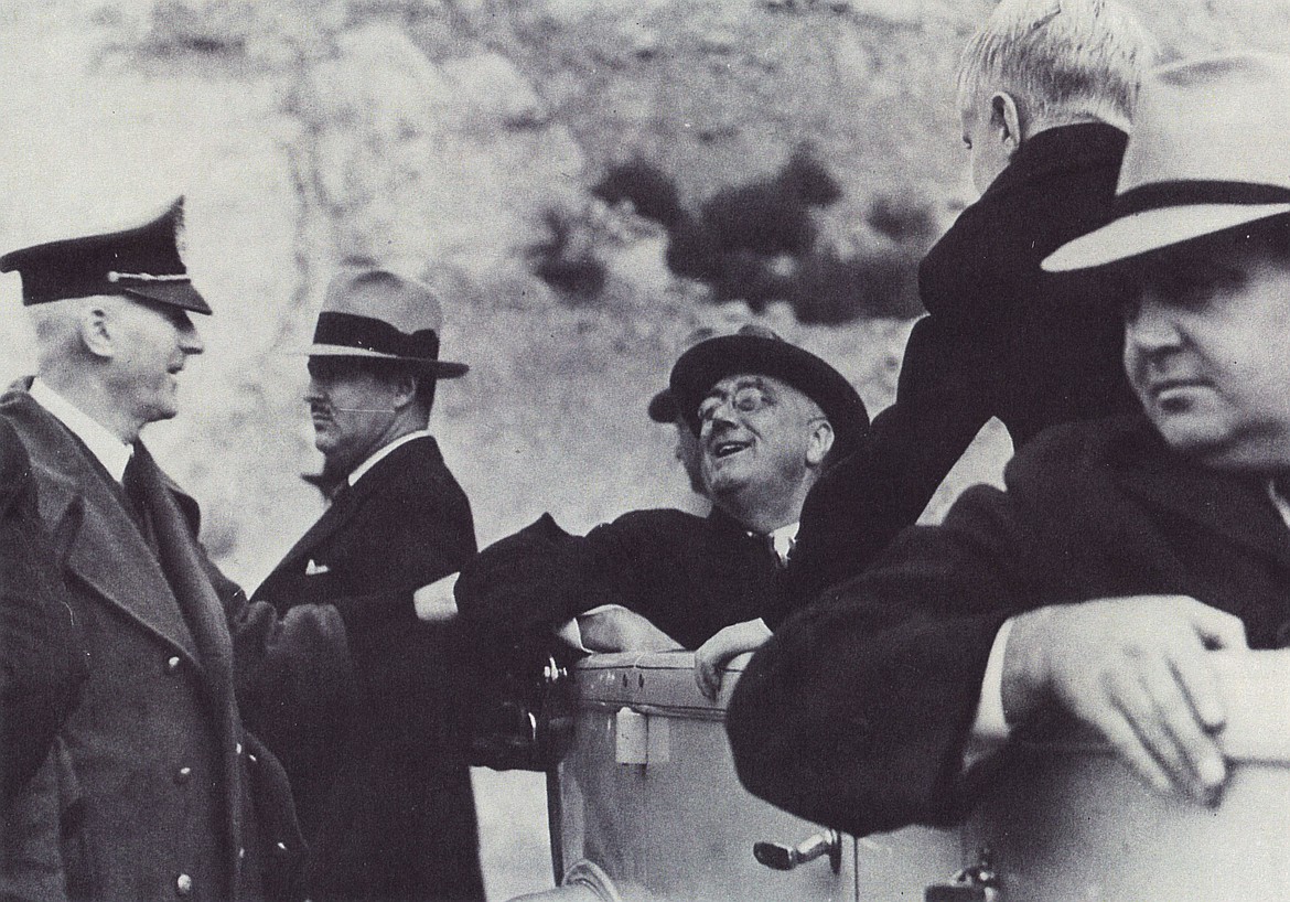 President Franklin D. Roosevelt chats with the Washington State Patrol's first chief, William Cole, on a trip to visit Grand Coulee Dam in 1937.