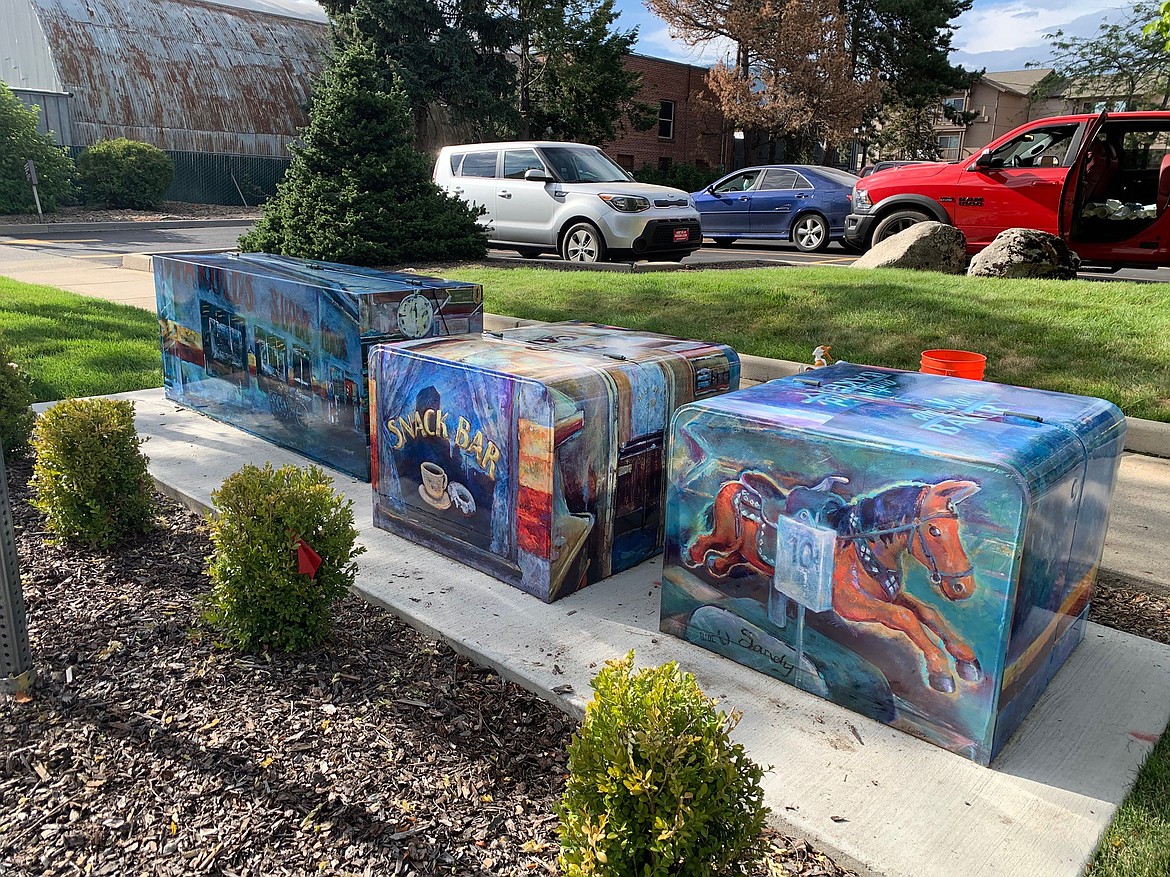 The artwork of artist Gail Lyster showcases Harold’s IGA on a trio of utility boxes on Oak Street.