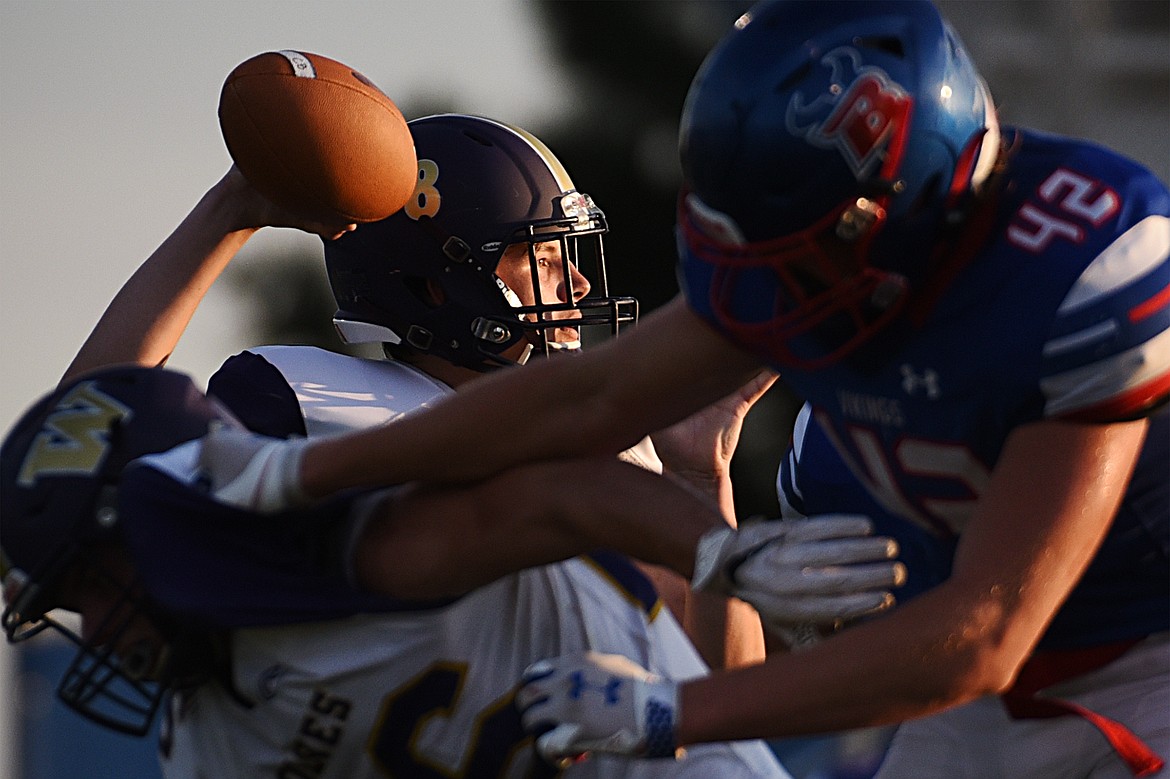 Cut Bank quarterback Caleb deManigold (8) looks to throw against Bigfork at Bigfork High School on Friday. (Casey Kreider/Daily Inter Lake)