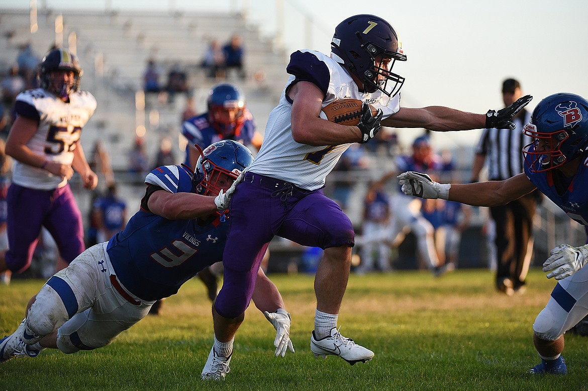 Cut Bank wide receiver Matt Larson (7) looks for running room after getting a handoff against Bigfork at Bigfork High School on Friday. (Casey Kreider/Daily Inter Lake)