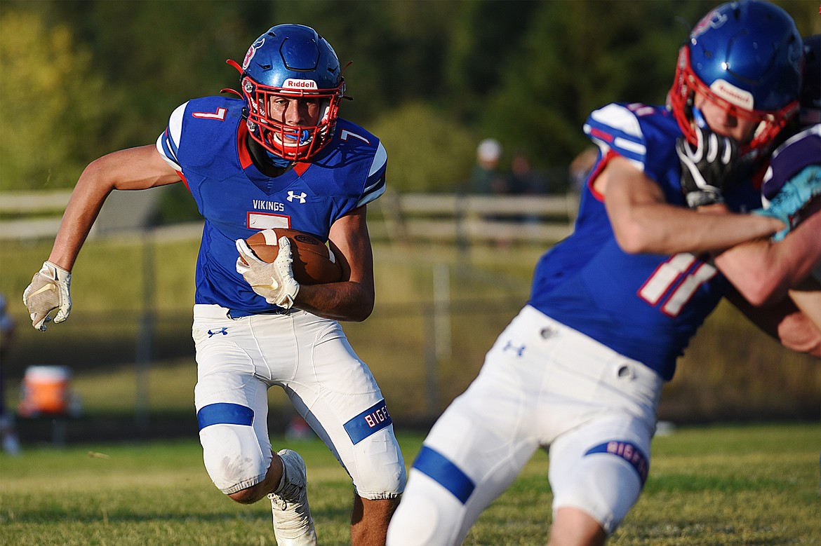 Bigfork running back Cormac Benn (7) looks for running room in the first quarter against Cut Bank at Bigfork High School on Friday. (Casey Kreider/Daily Inter Lake)