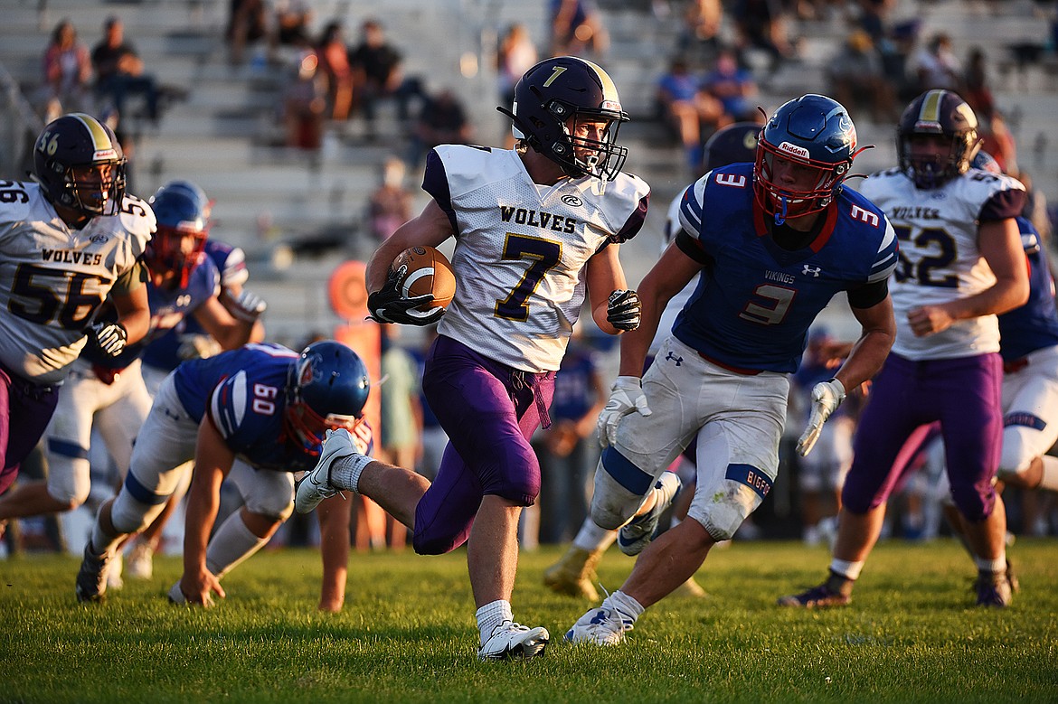 Cut Bank wide receiver Matt Larson (7) looks for running room after getting a handoff against Bigfork at Bigfork High School on Friday. (Casey Kreider/Daily Inter Lake)