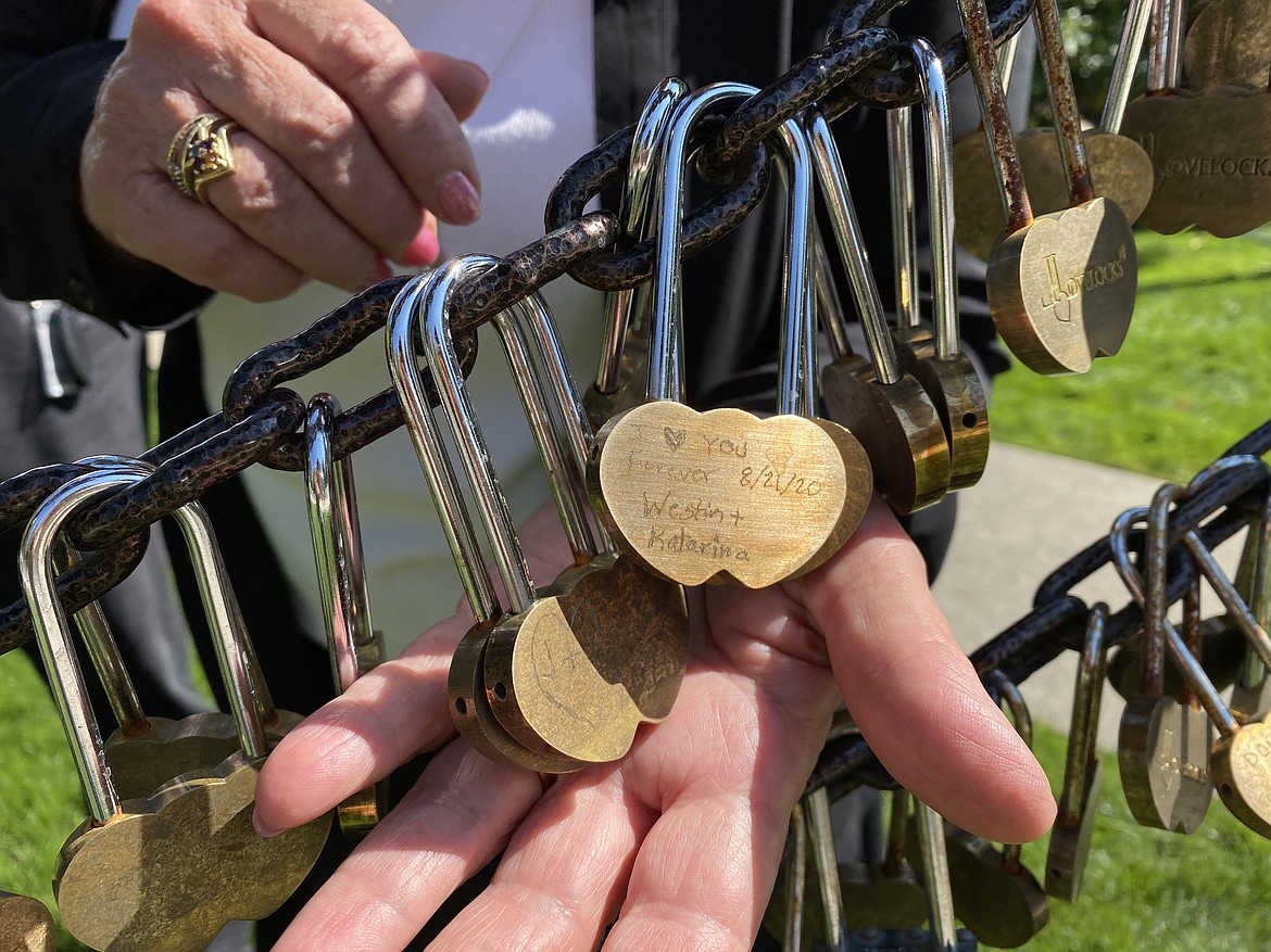 Lynn Knapp shows off The Hitching Post Wedding Chapel's "love locks" which signify the bond between newlyweds. (MADISON HARDY/Press)