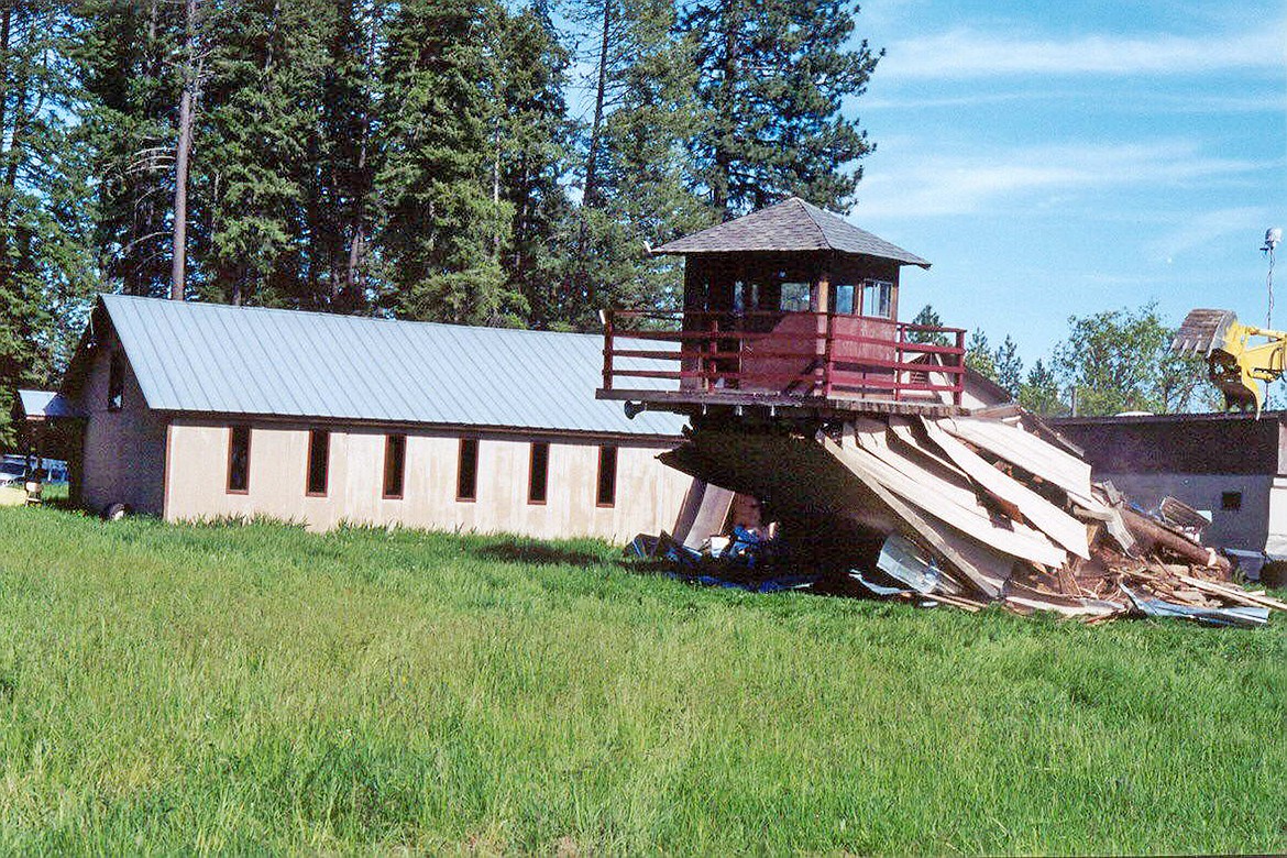 Buildings at the Aryan Nation compound are toppled after the 2000 verdict against the group forced it into bankruptcy. Photo by Diana Gissel.