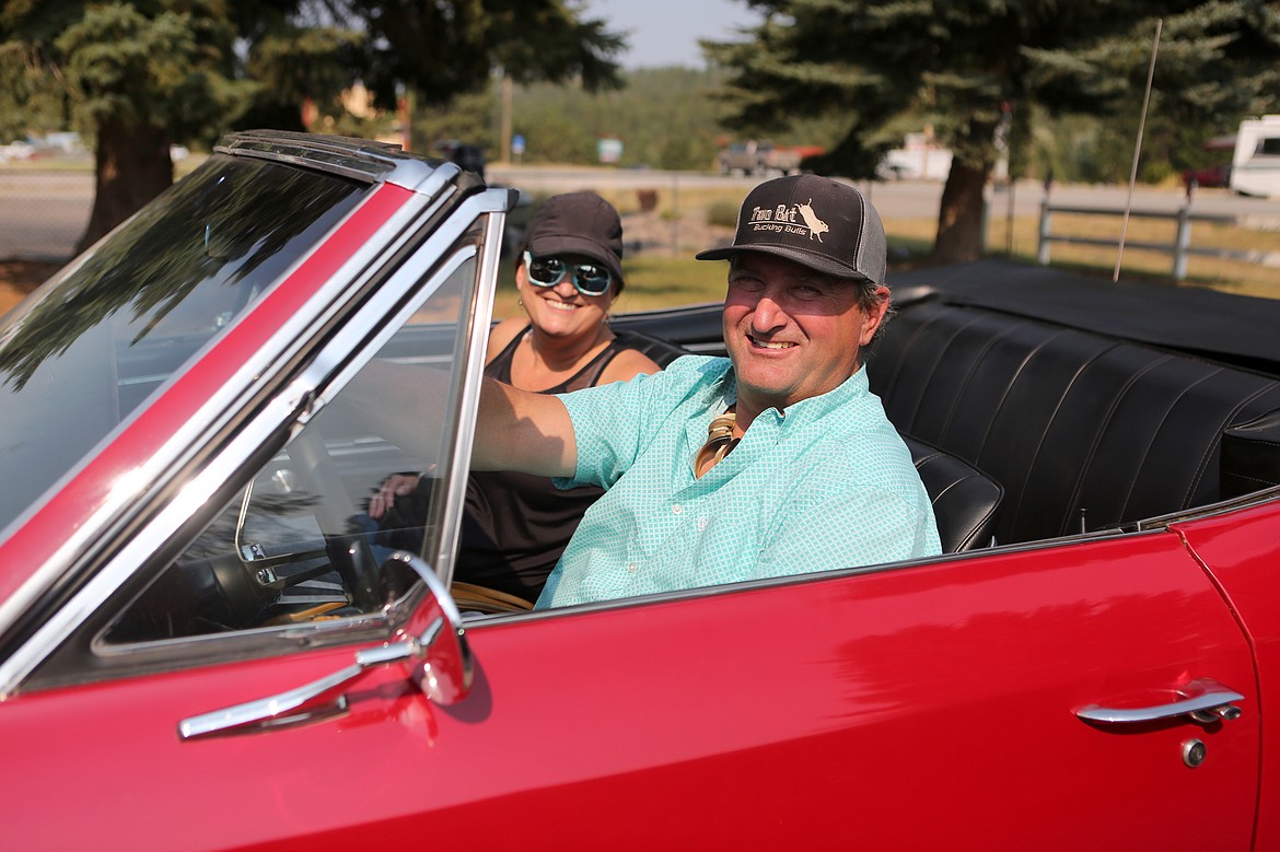 Shawn and Tami Simes are all smiles in their 66 Chevrolet Chevelle.