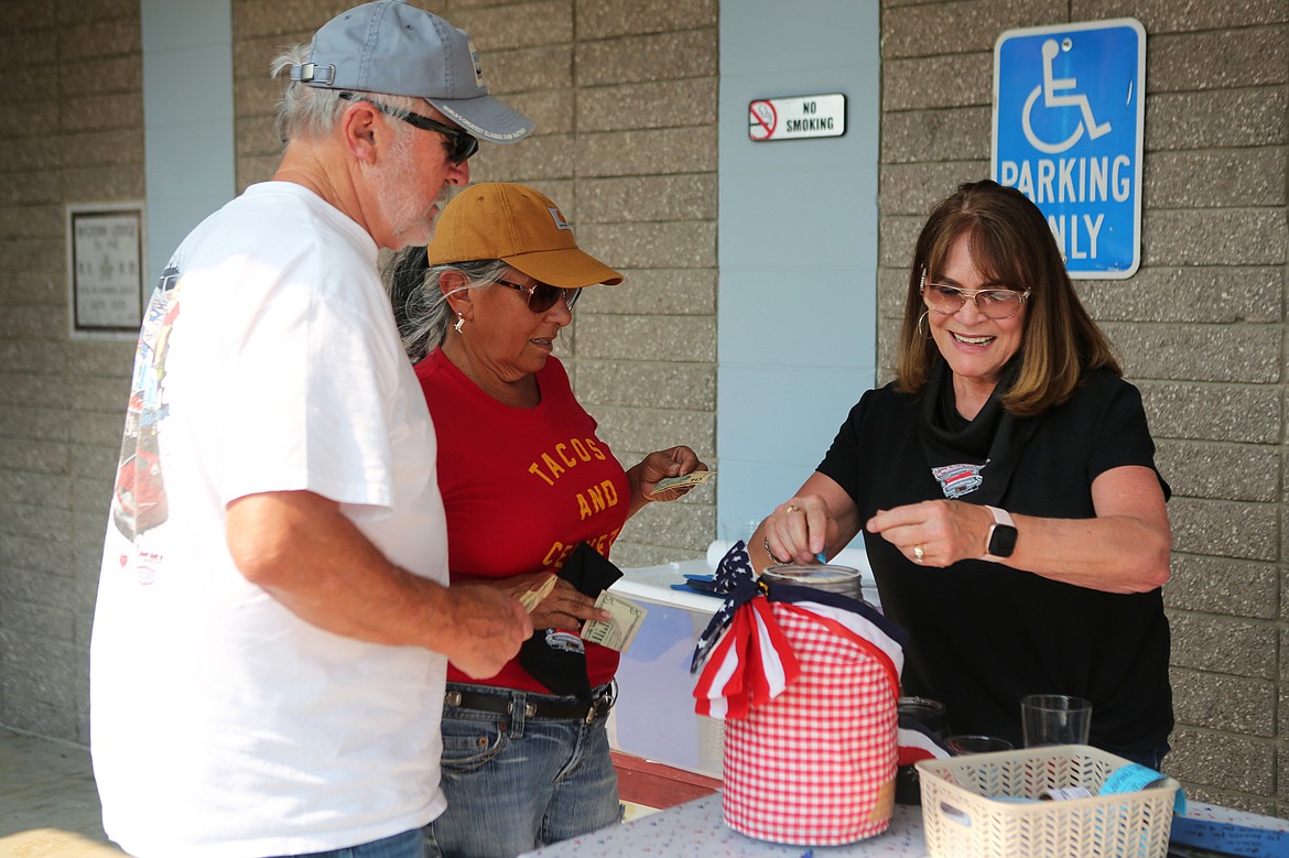Participants in the Rumble in the Bay Poker Run purchase raffle tickets Saturday afternoon at VFW Post 4042. The VFW organizes the event and proceeds help fund vocational scholarships and local veterans organizations.