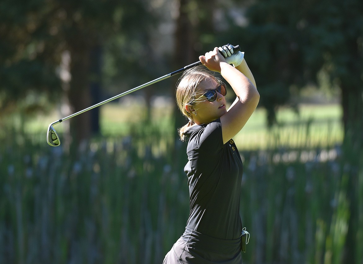 Bulldog Maddie Sramek tees off on the second hole during the Whitefish Triangular tournament last week at Whitefish Lake Golf Club. (Heidi Desch/Whitefish Pilot)