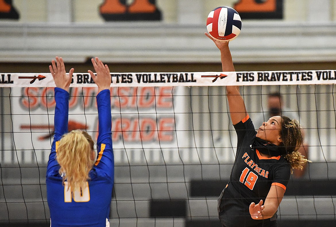 Flathead’s Akilah Kubi (19) looks for a kill against Missoula Big Sky at Flathead High School on Tuesday. (Casey Kreider/Daily Inter Lake)