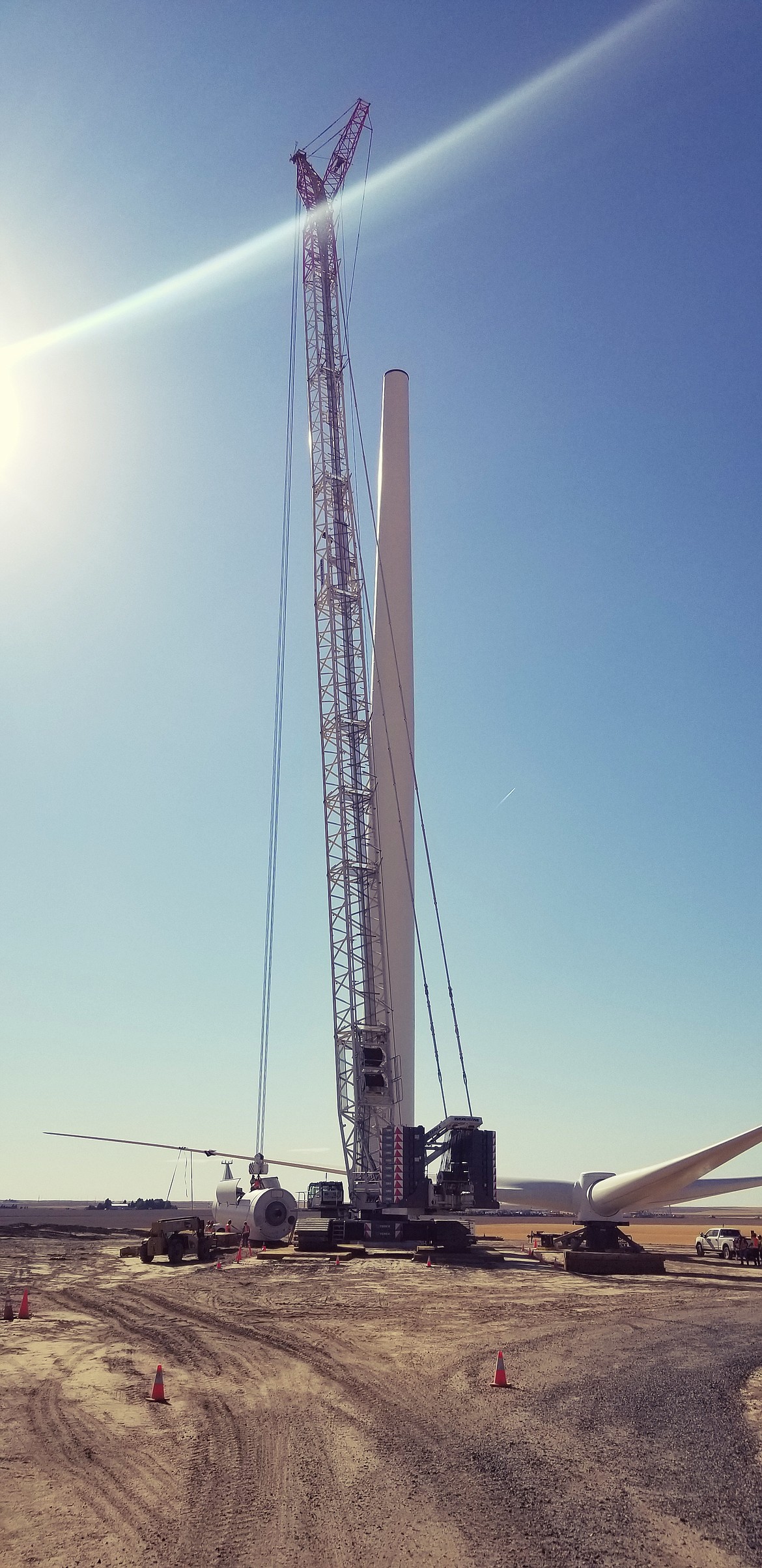 Workers with Clearwater Energy assemble a wind tower on Rattlesnake Flat earlier this summer.