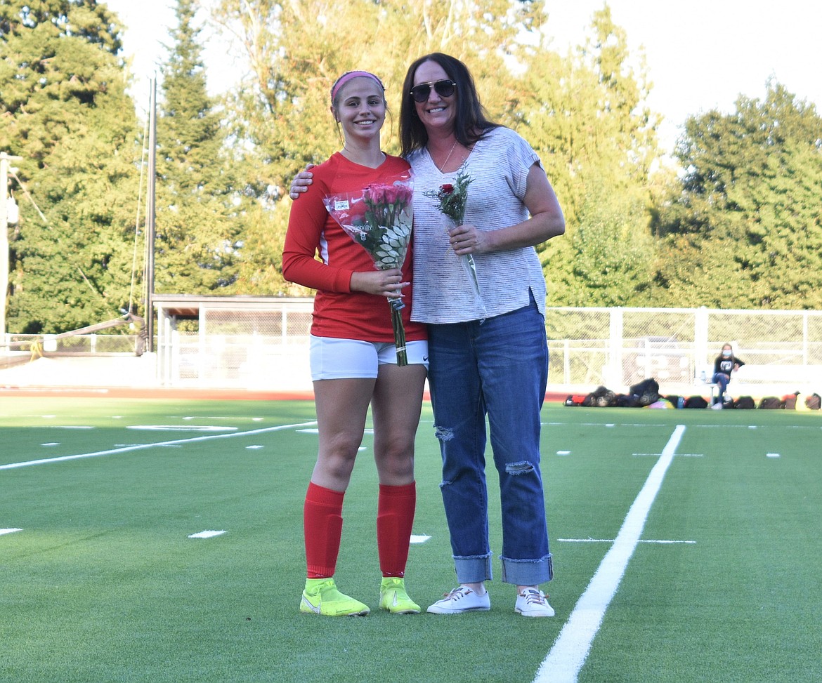 Kendall Rubright poses for a photo with her mom on senior night.