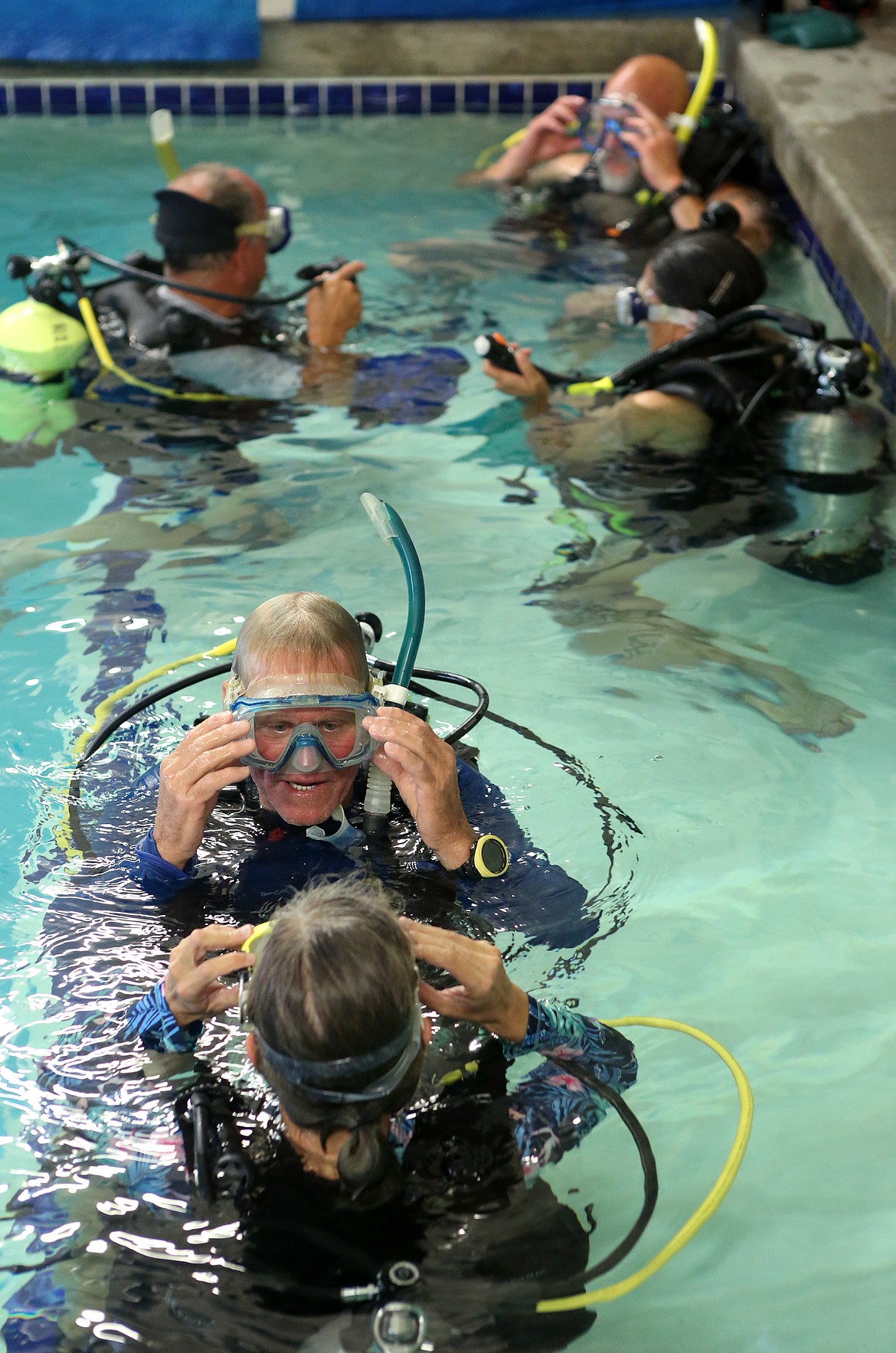 Instructor and Flathead Scuba owner Glen McKinnon works with Christina Ryan,director of the Kalispell Vet Center on Aug. 24 at Flathead Scuba in Kalispell. 
(Mackenzie Reiss/Daily Inter Lake)