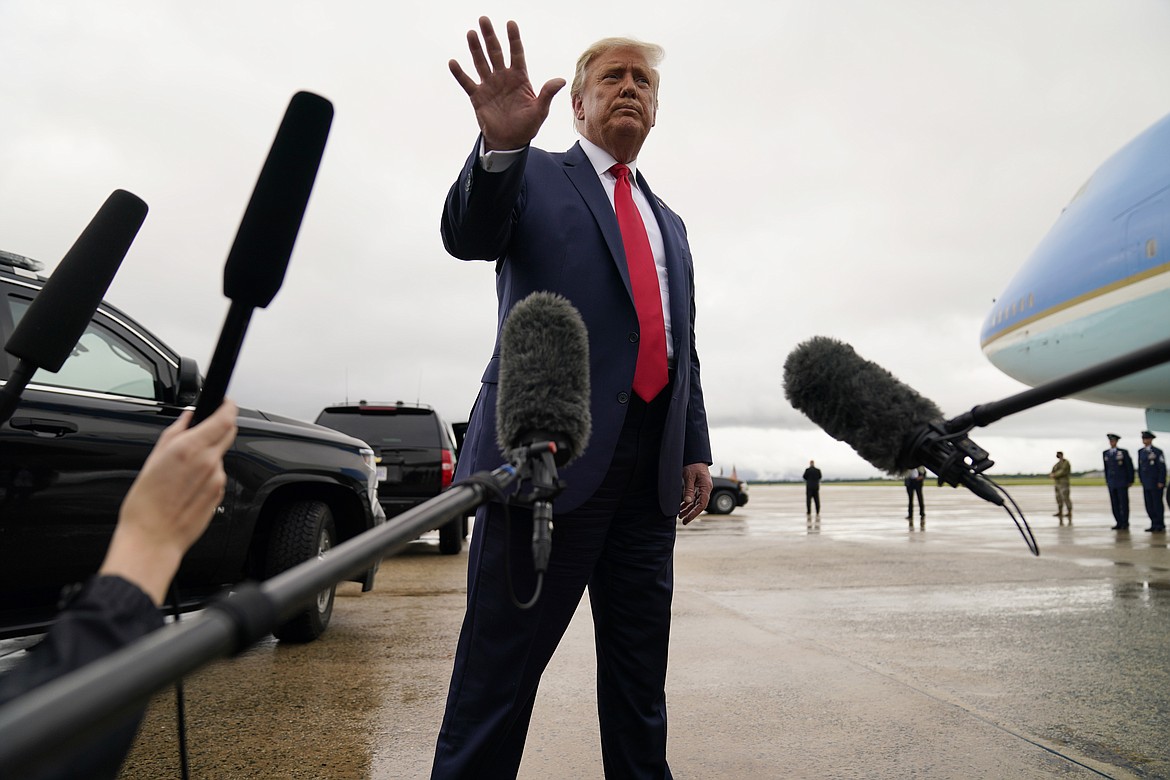 President Donald Trump walks away from the media to board Air Force One for a trip to a campaign rally in Freeland, Mich., Thursday, Sept. 10, 2020, in Andrews Air Force Base, Md.