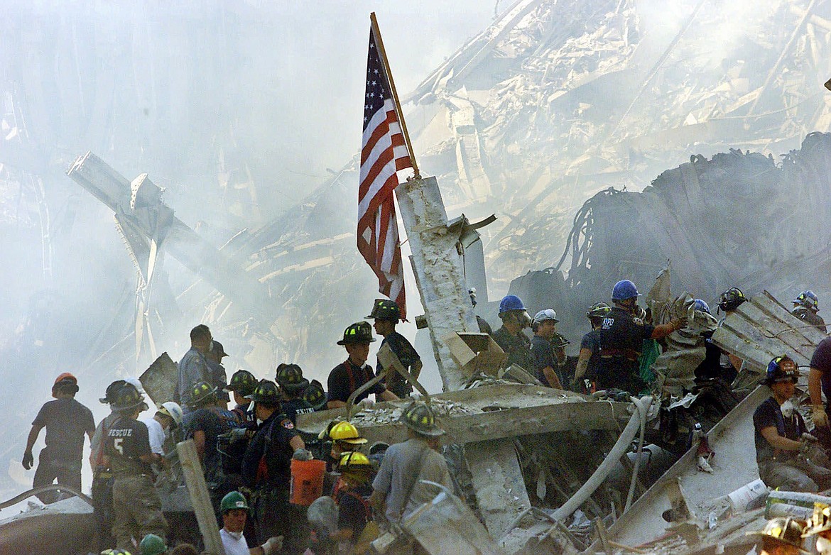 AP Photo/Beth A. Keiser, File
In this Sept. 13, 2001, file photo, an American flag flies over the rubble of the collapsed World Trade Center buildings in New York.