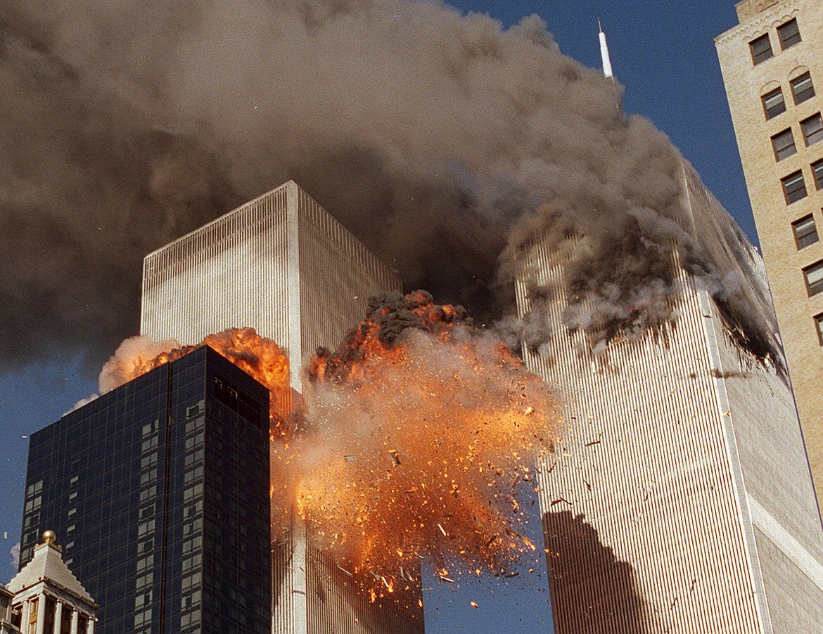 AP Photo/Chao Soi Cheong
In this Sept. 11, 2001, file photo, smoke billows from World Trade Center Tower 1 and flames explode from Tower 2 as it is struck by American Airlines Flight 175, when terrorists crashed hijacked airliners into the buildings.