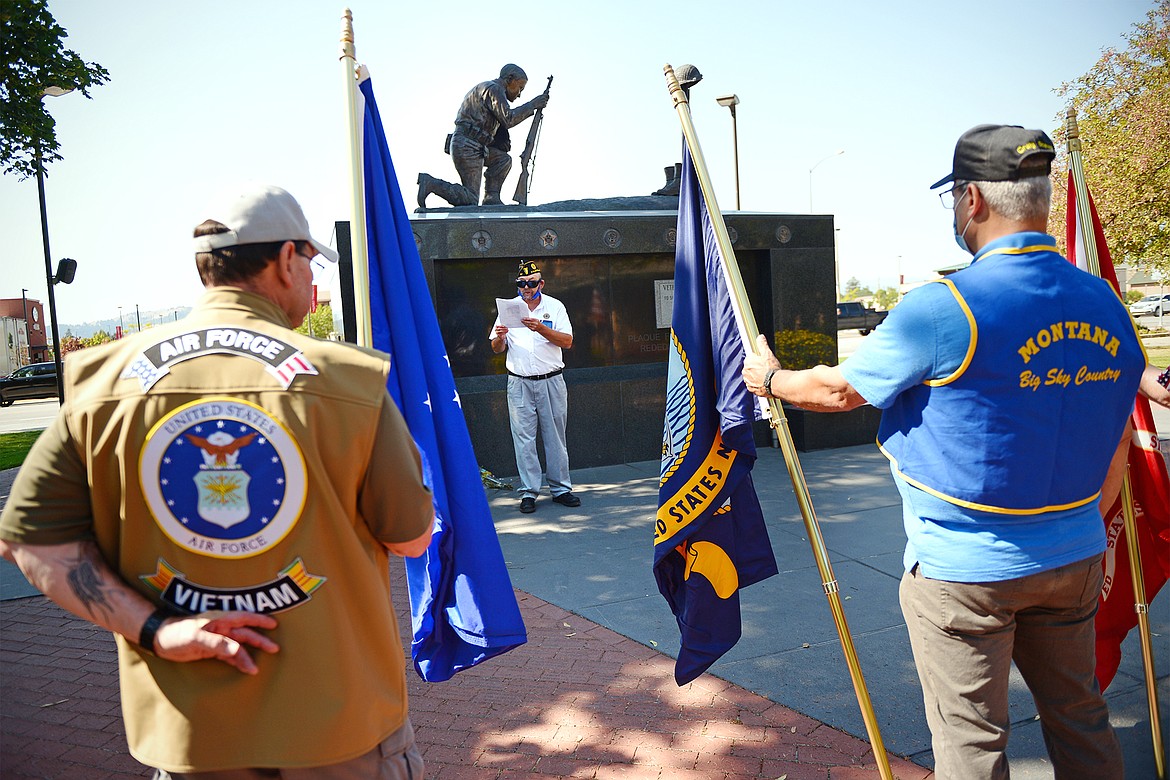 Robert Lehman Jr., center, Post Commander at American Legion Post 137 in Kalispell, speaks at the Veterans Memorial of Flathead Valley at Depot Park after the Freedom Walk on Friday, Sept. 11. Participants in the Freedom Walk gather at the American Legion and walk to the Veterans Memorial of Flathead Valley at Depot Park to commemorate Patriot Day and the terrorist attacks on Sept. 11, 2001 .(Casey Kreider/Daily Inter Lake)