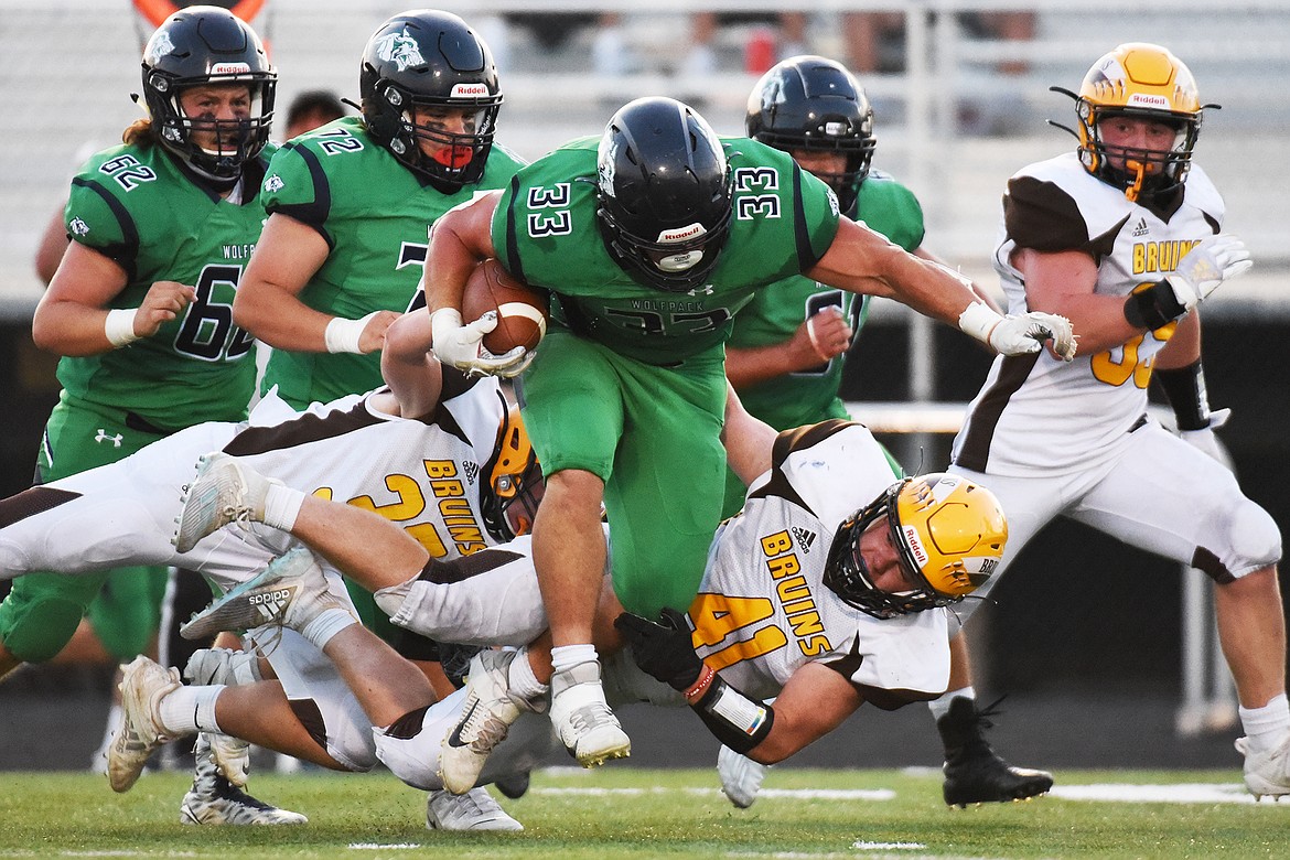 Glacier running back Jake Rendina (33) picks up yardage after a second quarter reception against Helena Capital at Legends Stadium on Friday. (Casey Kreider/Daily Inter Lake)