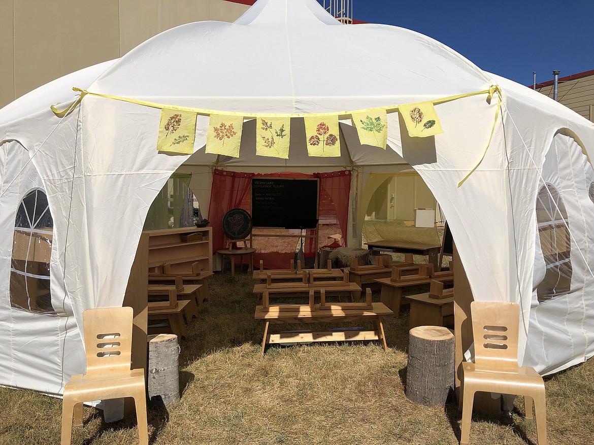 An octogon-shaped tent is shown aftering being transformed into an outdoor classroom by Sandpoint Waldorf School staff and parents.