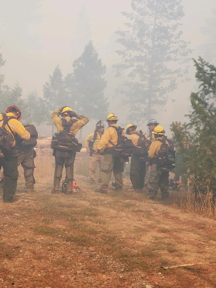Fire crews gear up Monday morning before their first approach to the Blanchard fire. After reaching 740 acres and destroying four homes, crews successfully extinguished the fire Friday afternoon. (Photo by Bunny Horn)