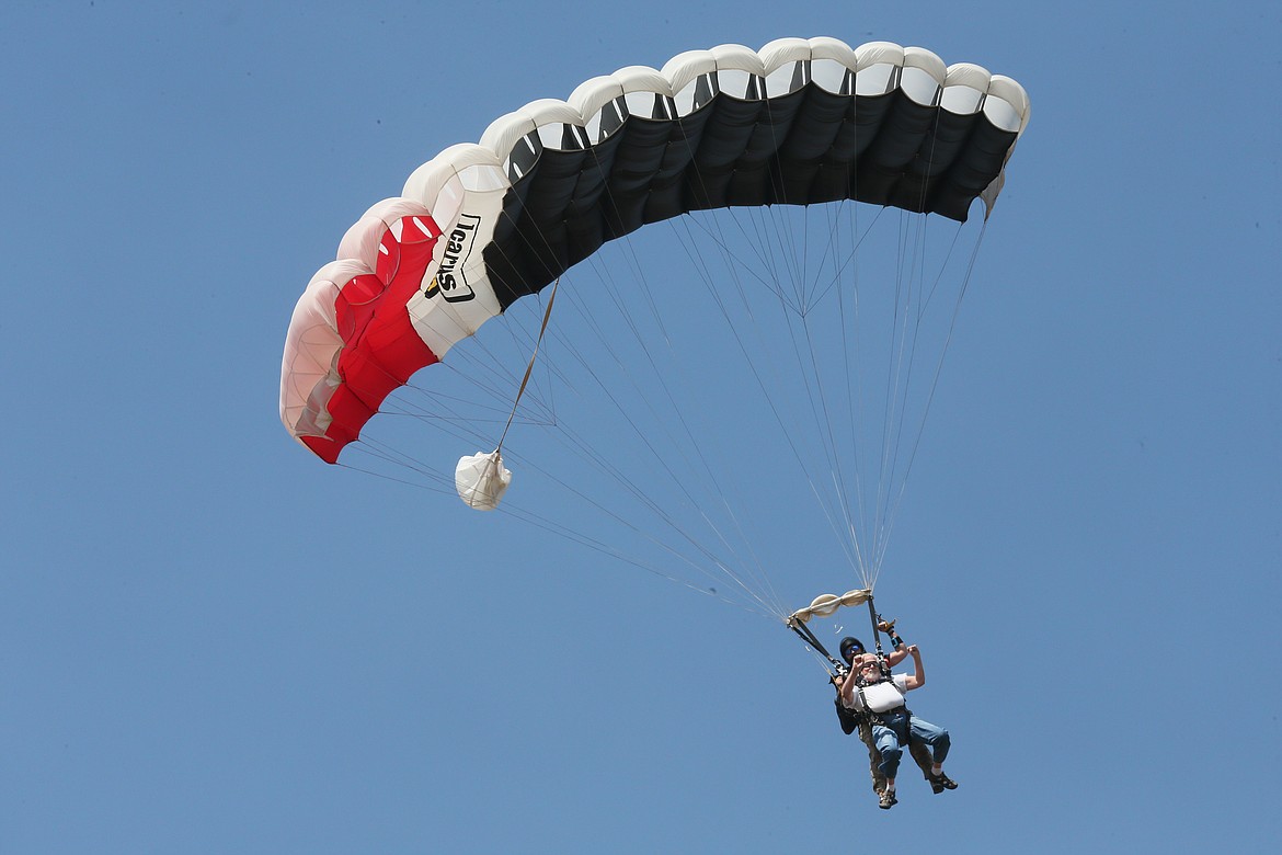Gary Pomeroy skydives in memory of his late sister, Linda Schultz, and to honor veterans and 9/11 victims during a special skydiving event at the Coeur d'Alene Airport on Friday.