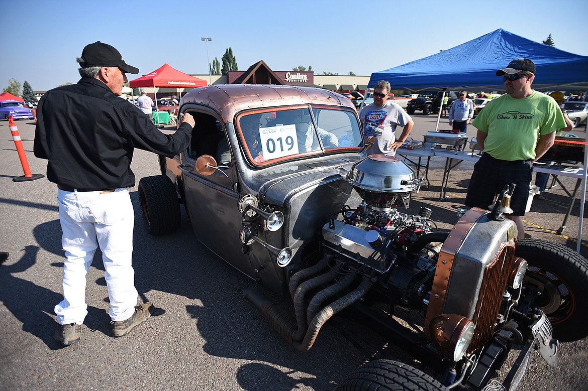 Greg and Tana Greene's 1939 Chevy Rat Rod is judged after driving through the Evergreen Show ’N Shine virtual car show at Conlin’s Furniture on Saturday.  (Casey Kreider/Daily Inter Lake)