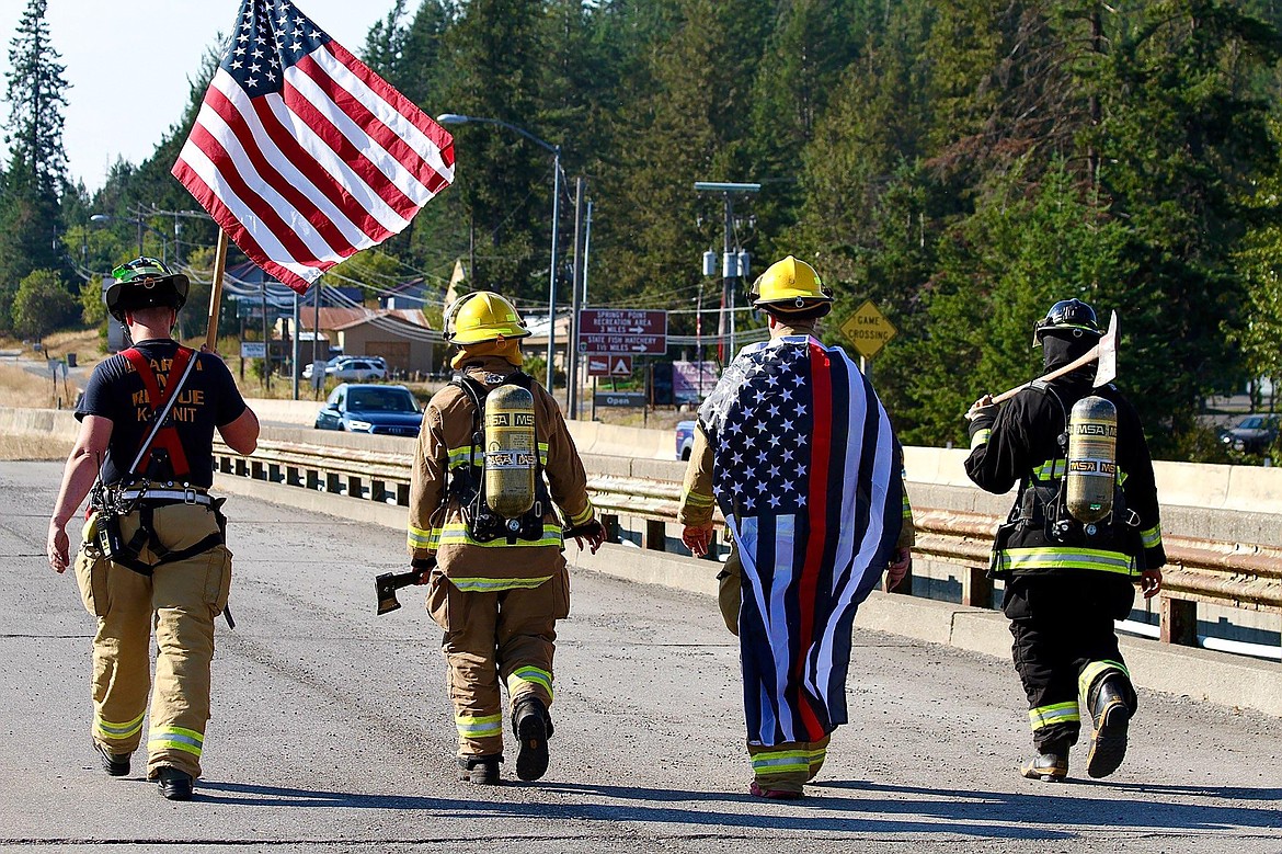 Austin Theander, Grant Bansemer, Cecil Jensen and Timo Schacht walk across the Long Bridge to pay tribute to those injured and lost in the Sept. 11, 2001, terrorist attacks in New York City, Arlington, Va., and Shanksville, Pa.