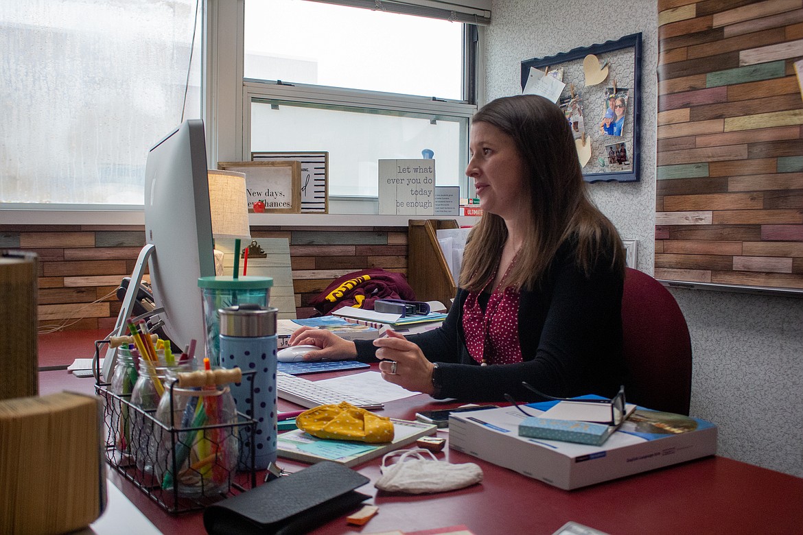 Tiffany Janosov works at her desk in her classroom at Moses Lake High School on Monday, Sept.14, afternoon after finishing up her online class periods earlier that morning. Janosov said afternoons consist of office hours where students can contact teachers with any issues, questions, or concerns.