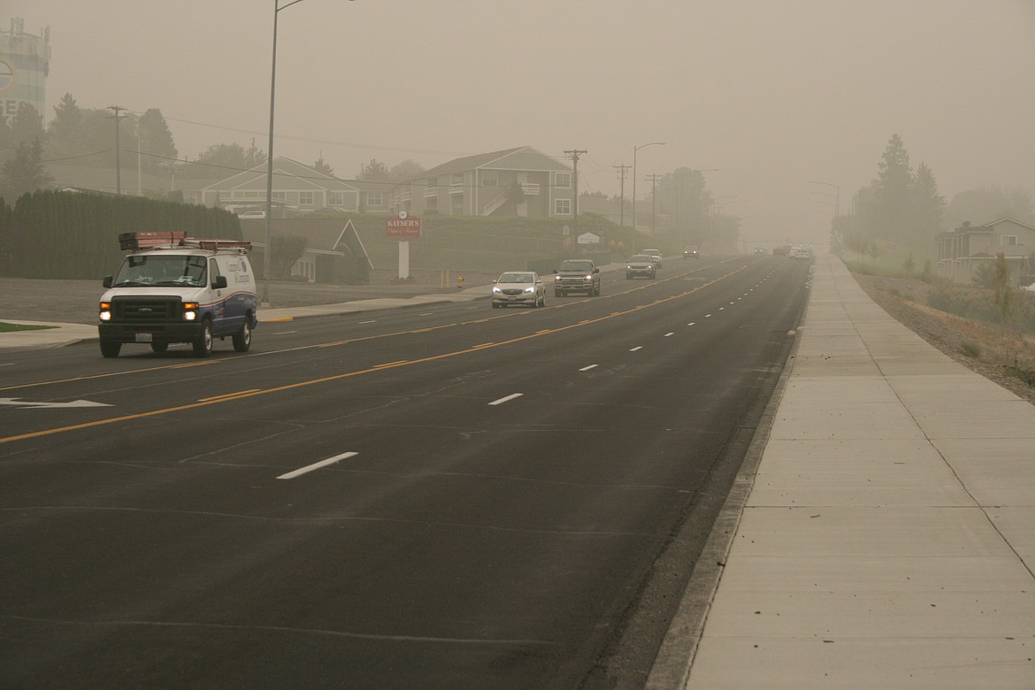 Thick smoke forced drivers to turn on their lights at mid-morning Monday. Smoky conditions are expected to continue throughout the week.