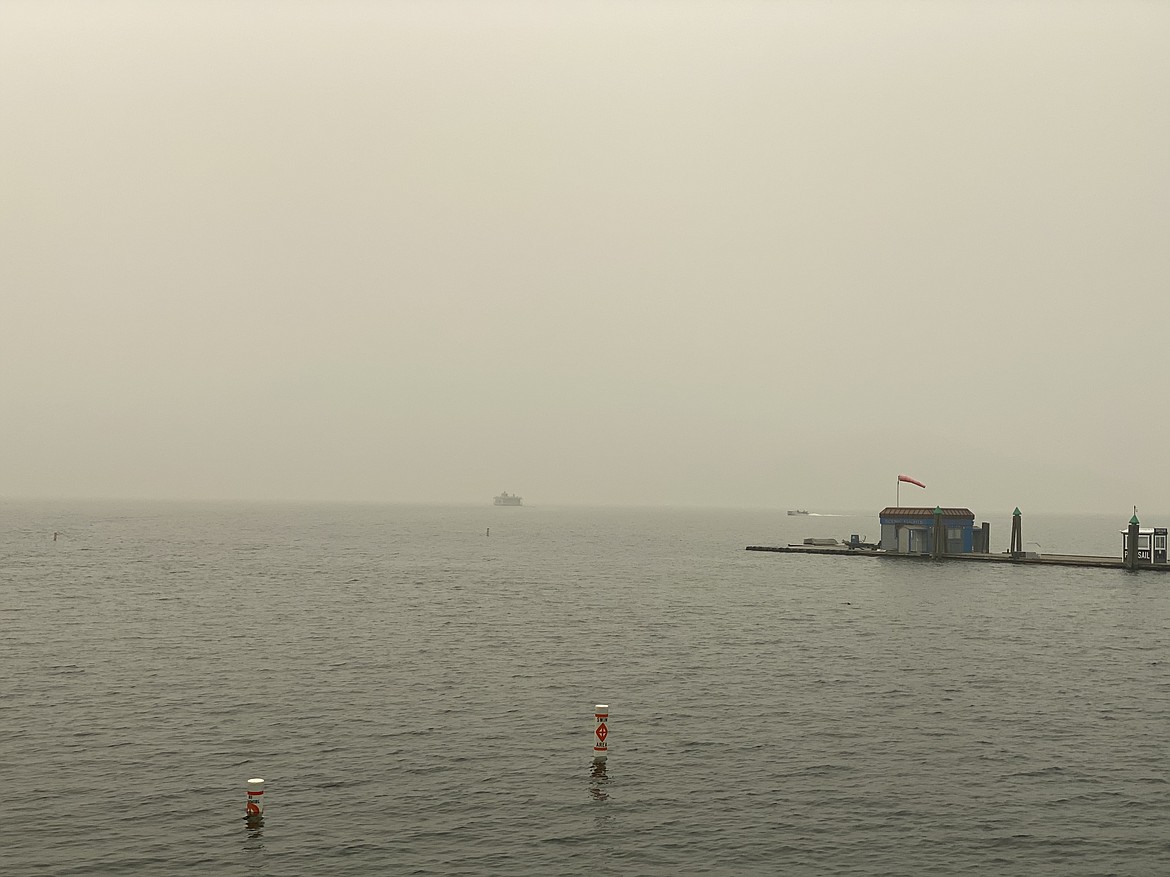 A cruise ship sets sail into the smoky cover on Lake Coeur d'Alene on Monday. (MADISON HARDY/Press)