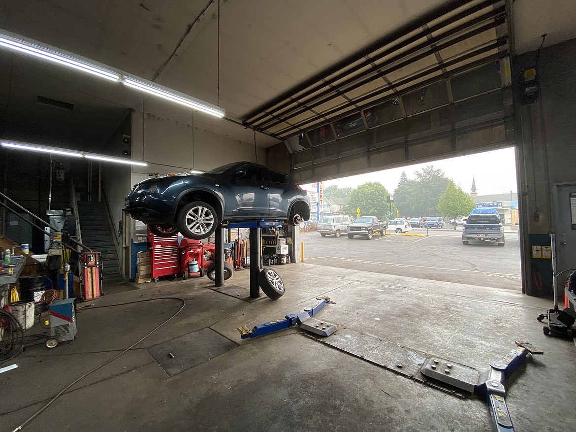 Visible smoke pollution is seen from the garage of Auto Automotive Monday afternoon. (MADISON HARDY/Press)