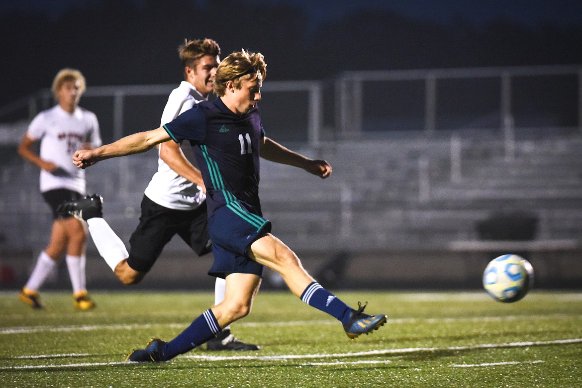 Glacier's Parker Creer (11) scores a first-half goal against Flathead during crosstown soccer at Legends Stadium on Tuesday. (Casey Kreider/Daily Inter Lake)