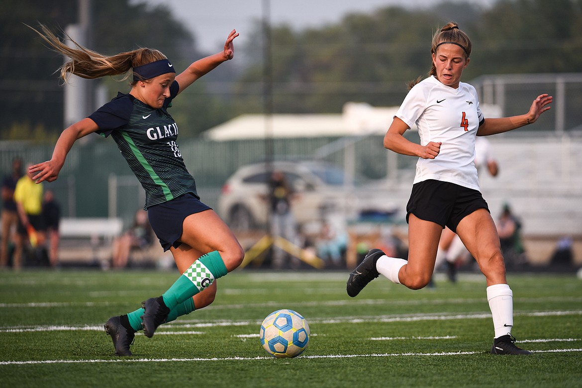 Glacier's Madison Becker (18) scores the lone goal of the match in the first half against Flathead during crosstown soccer at Legends Stadium on Tuesday. (Casey Kreider/Daily Inter Lake)