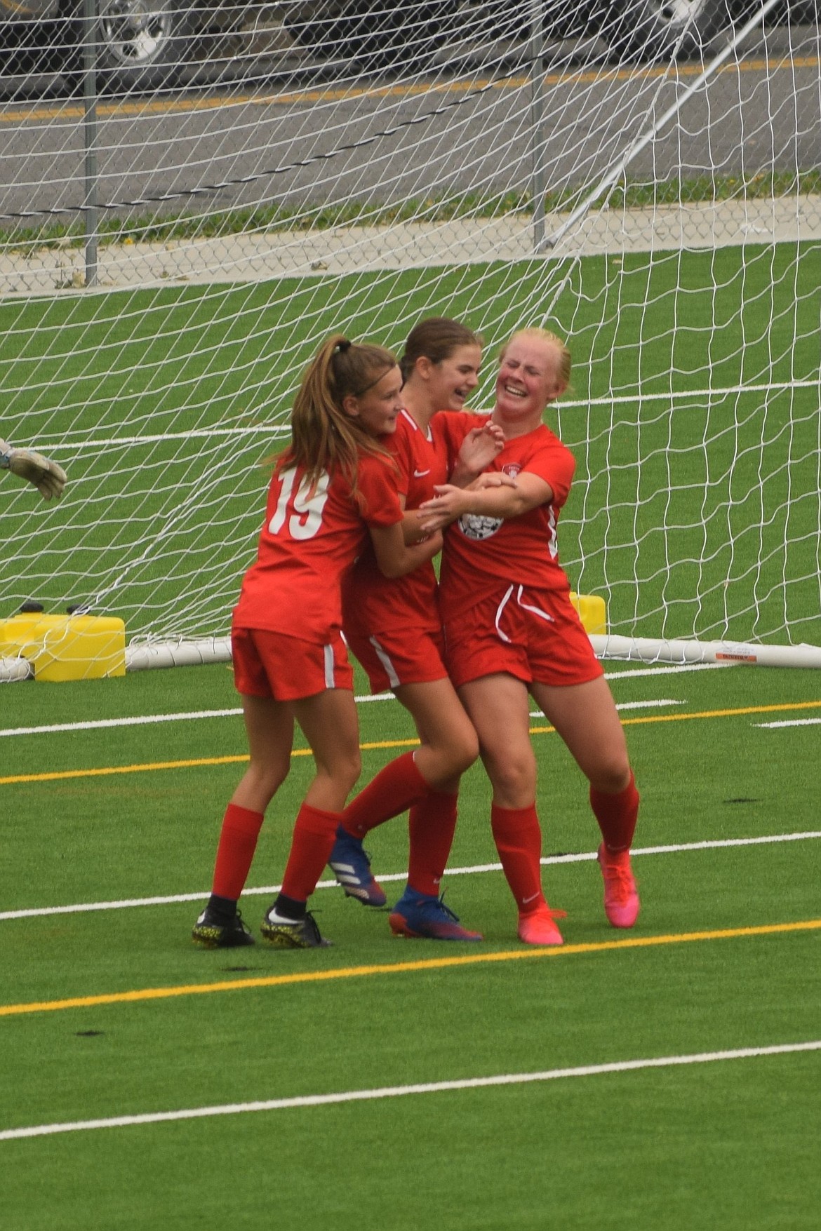 Photo by MARCEE HARTZELL
Natalie Thompson, left, and Kennedy Hartzell, right celebrate with Libby Morrisroe after Morrisroe scores from a breakaway assist from Hartzell. The Thorns North FC girls 07 soccer team started the Pend Oreille Cup off great, beating EW Surf G07 WNPL 2-0 in the first of three games, before the AQI rose to a level that forced the tournament to cancel. The Thorns' other goal was scored by Rachel Corette (Kennedy Hartzell).