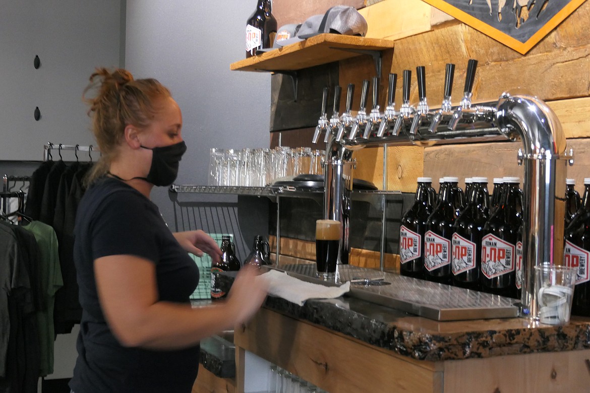 Natalie O'Brien serves up a foamy stout.