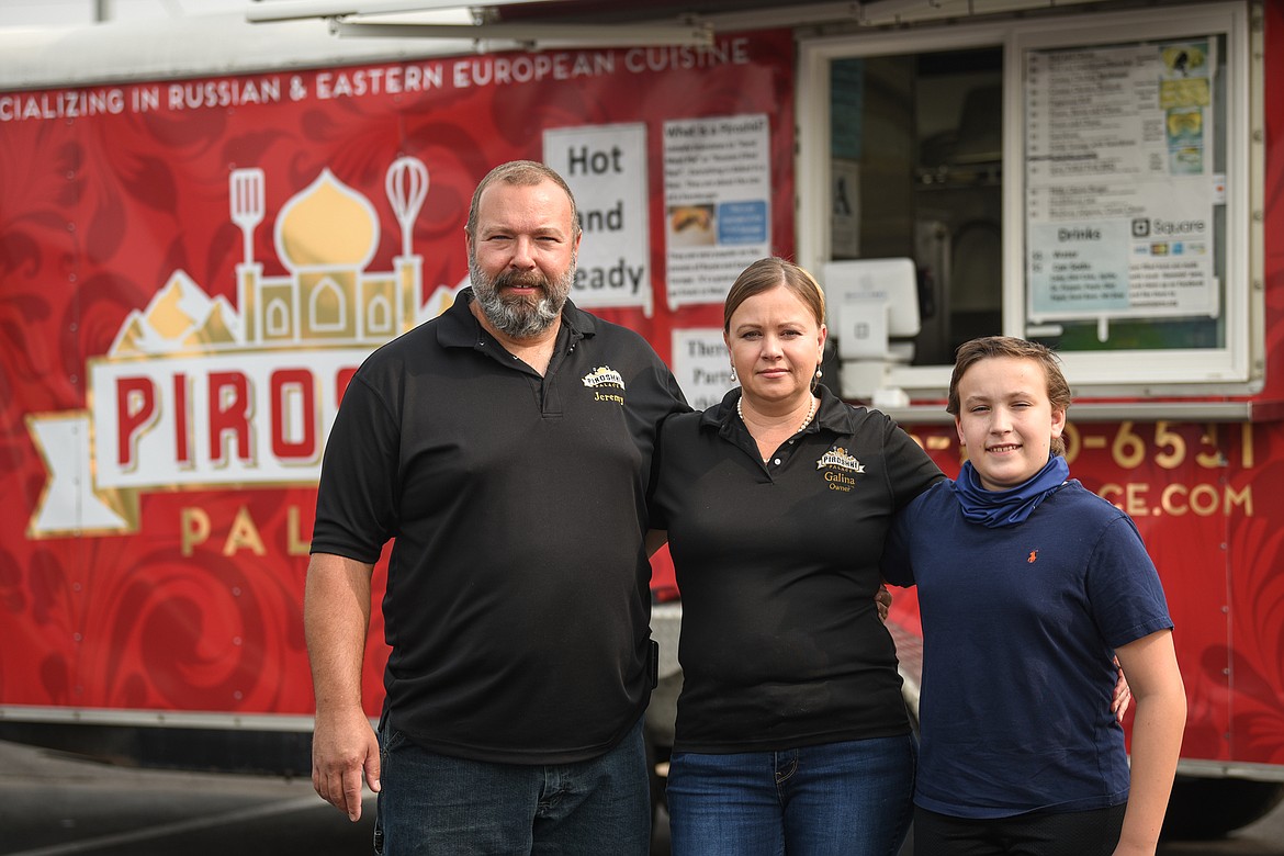 Jeremy, Galina and Jason Mays outside the Piroshki Palace food truck at Smart Foodservice in Evergreen on Wednesday, Sept. 16. (Casey Kreider/Daily Inter Lake)