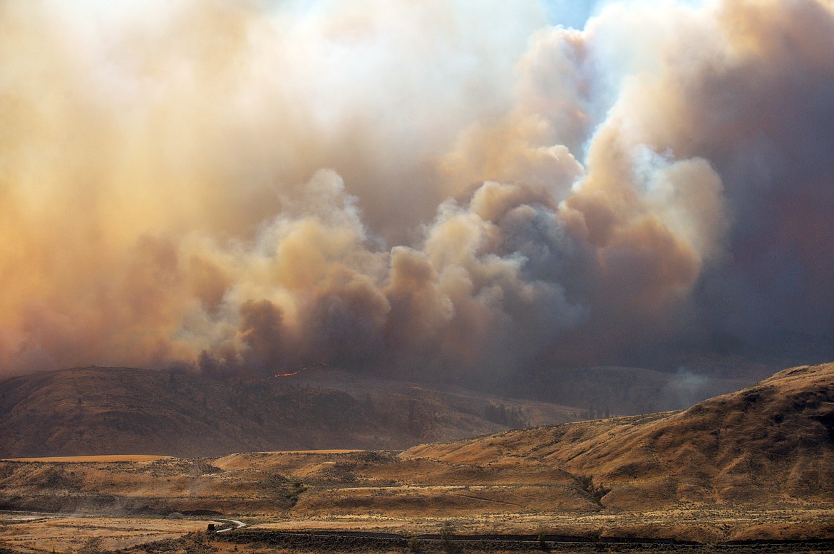 Al Camp, special to the Omak-Okanogan County Chronicle/courtesy photo

The Cold Springs Fire tops a ridge east of Okanogan in Okanogan County Sept. 7. Donations are being accepted for victims of the fire.