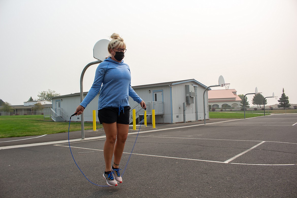 Park Orchard Elementary PE teacher, Cyndi Dickinson, jump ropes outside the school on Wednesday, Sept. 17, showcasing one of the numerous activities kids can do to stay in shape as many students begin the year remotely this fall.