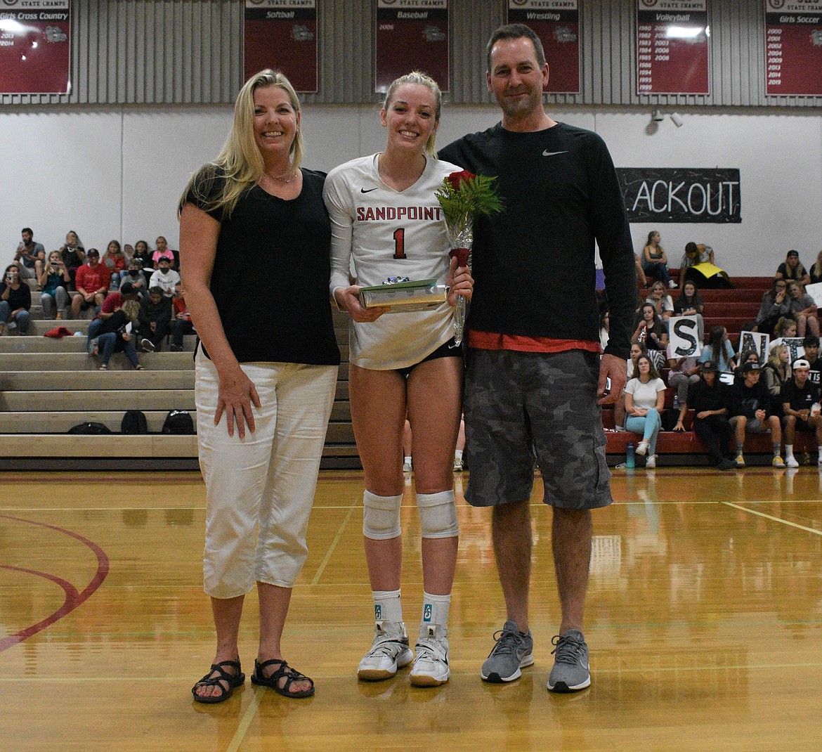 Gabby Hicks poses for a photo with her family on Senior Night.